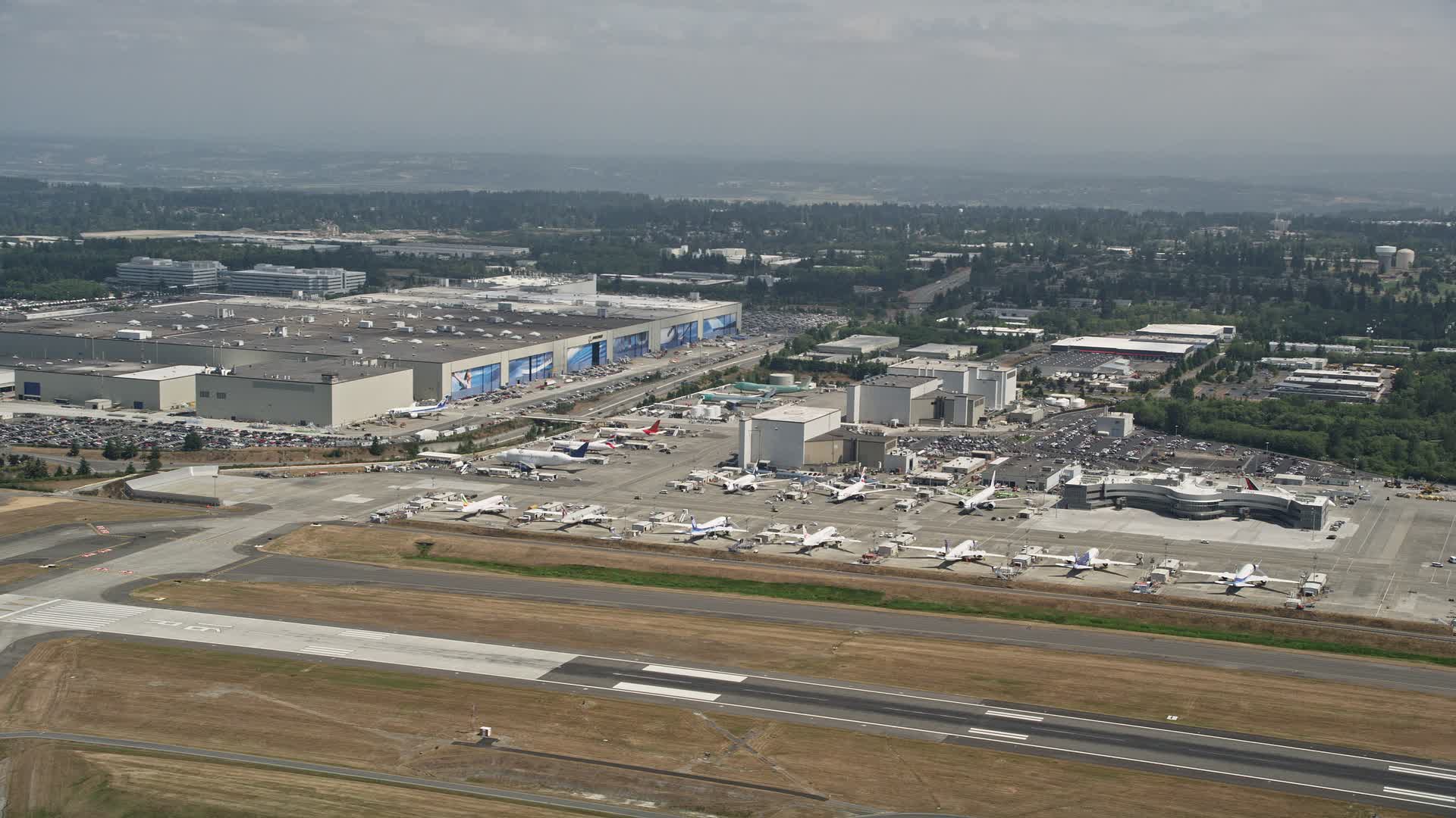 5K stock footage aerial video of airliners parked near the Boeing