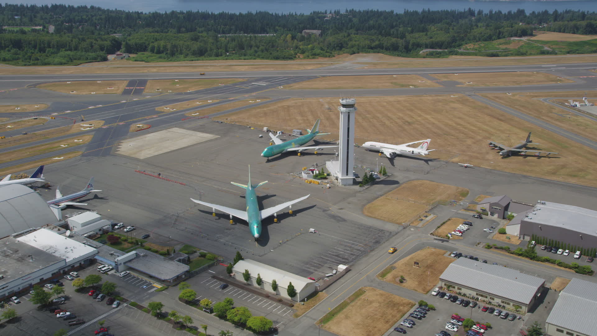 5K stock footage aerial video approach three airliners parked around an