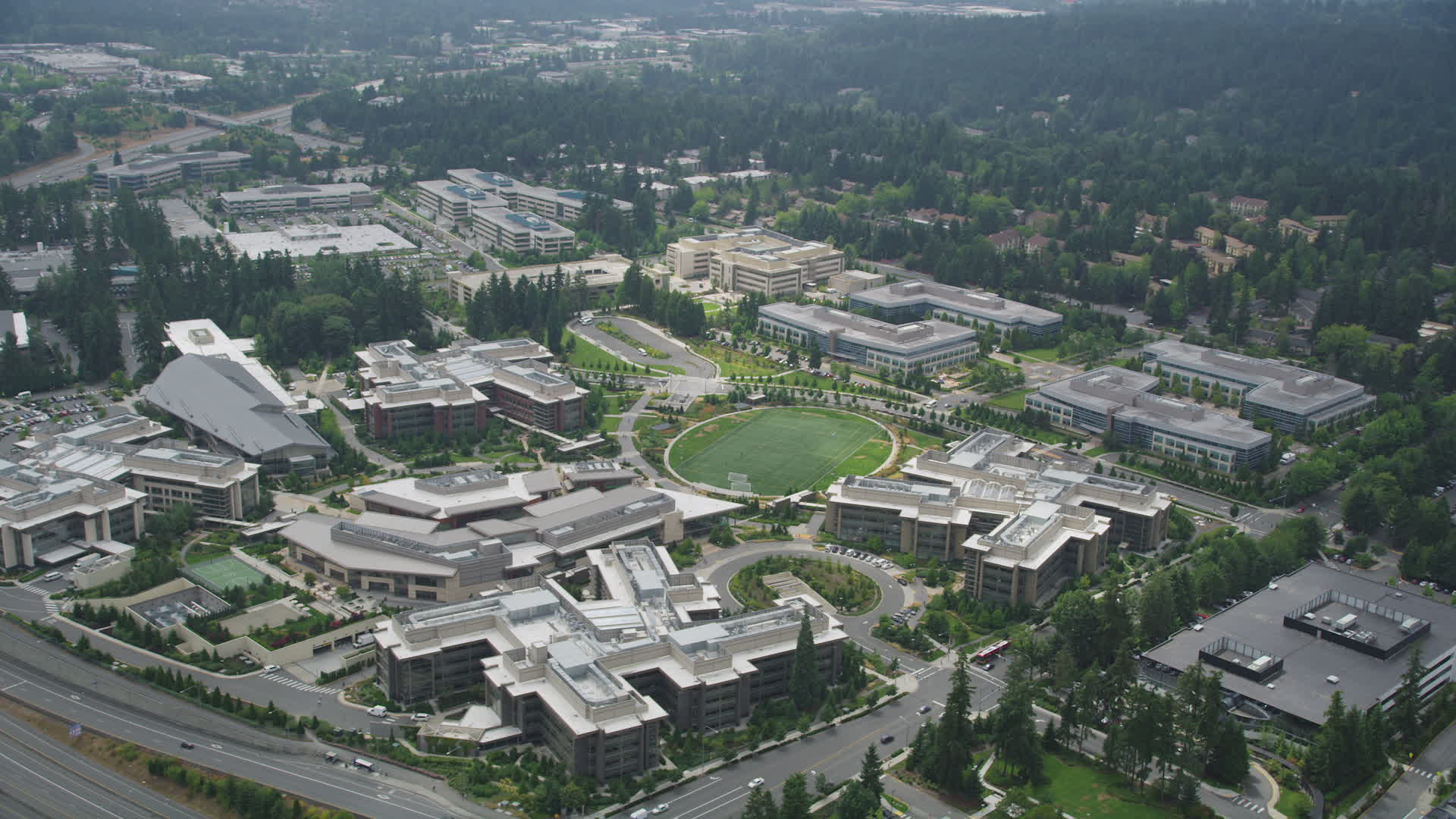 5k stock footage aerial video orbiting the commons soccer field and office buildings at 
