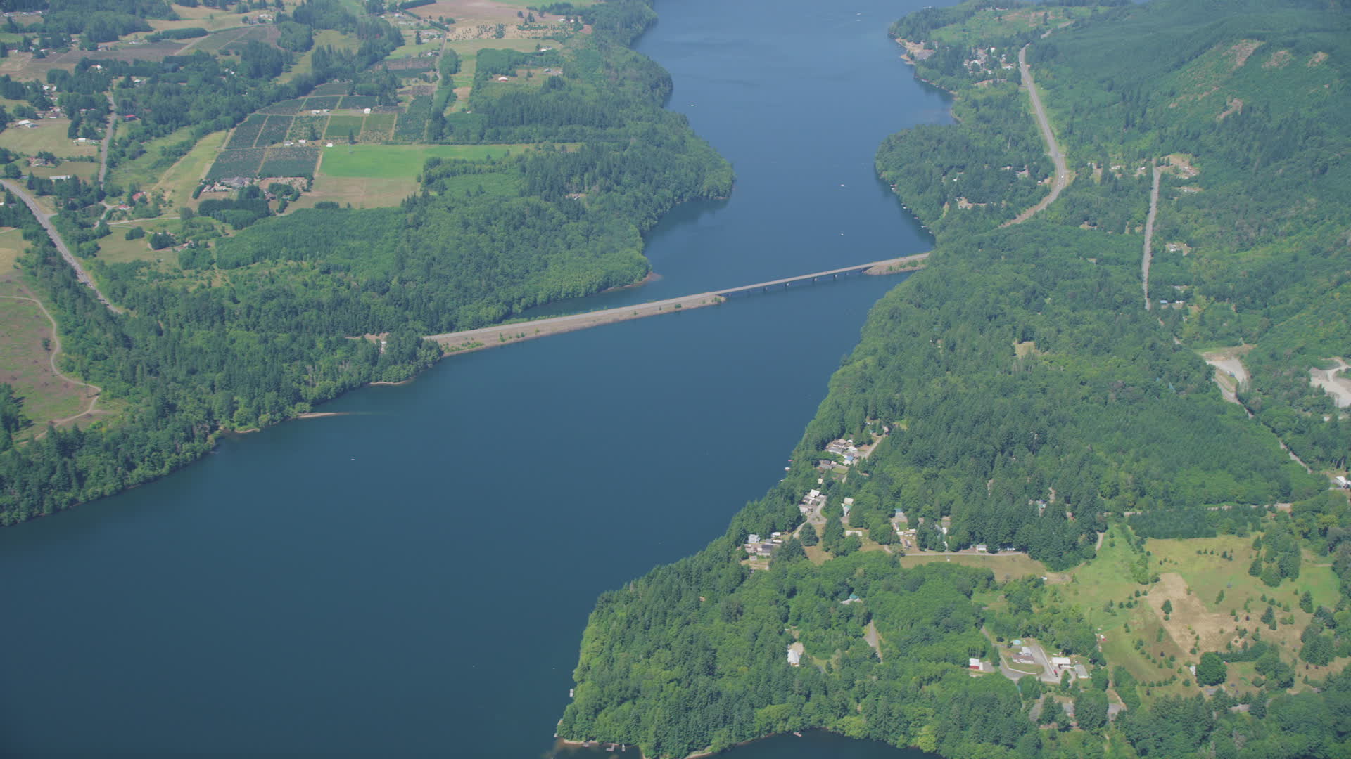 5K stock footage aerial video of reverse view of bridge spanning