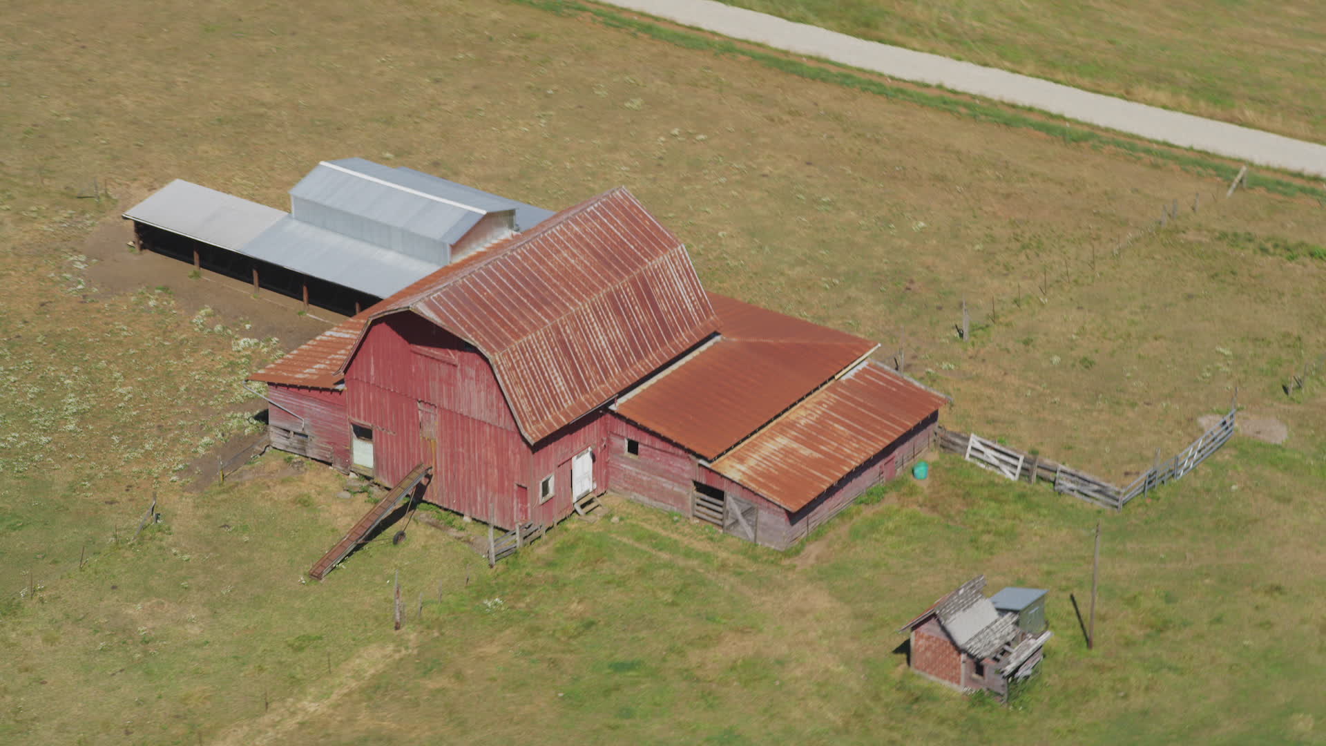 5K stock footage aerial video of old red barn in the middle of farm
