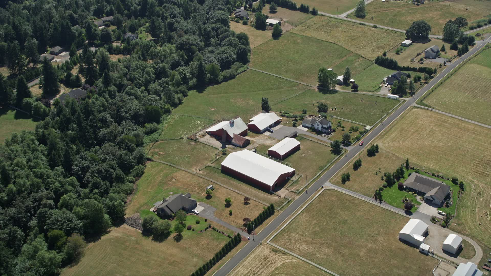 5K stock footage aerial video tilt to bird's eye view of farmhouse and