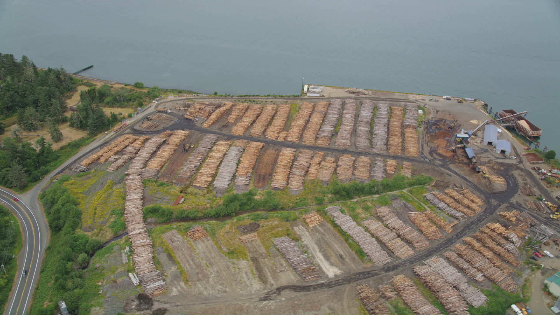 5K stock footage aerial video of piles of lumber at a lumber yard