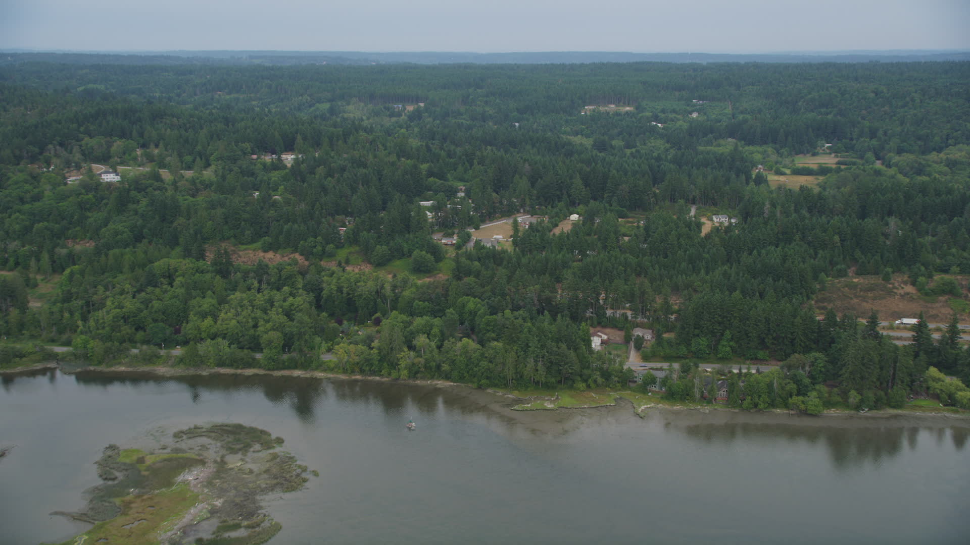 5K stock footage aerial video fly over Burley Lagoon to approach rural