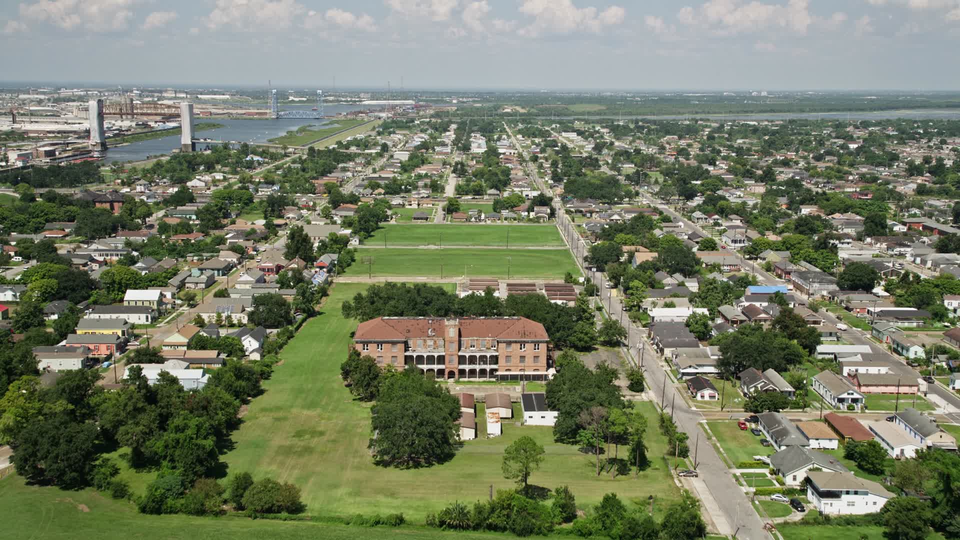 5K stock footage aerial video fly over abandoned school to approach