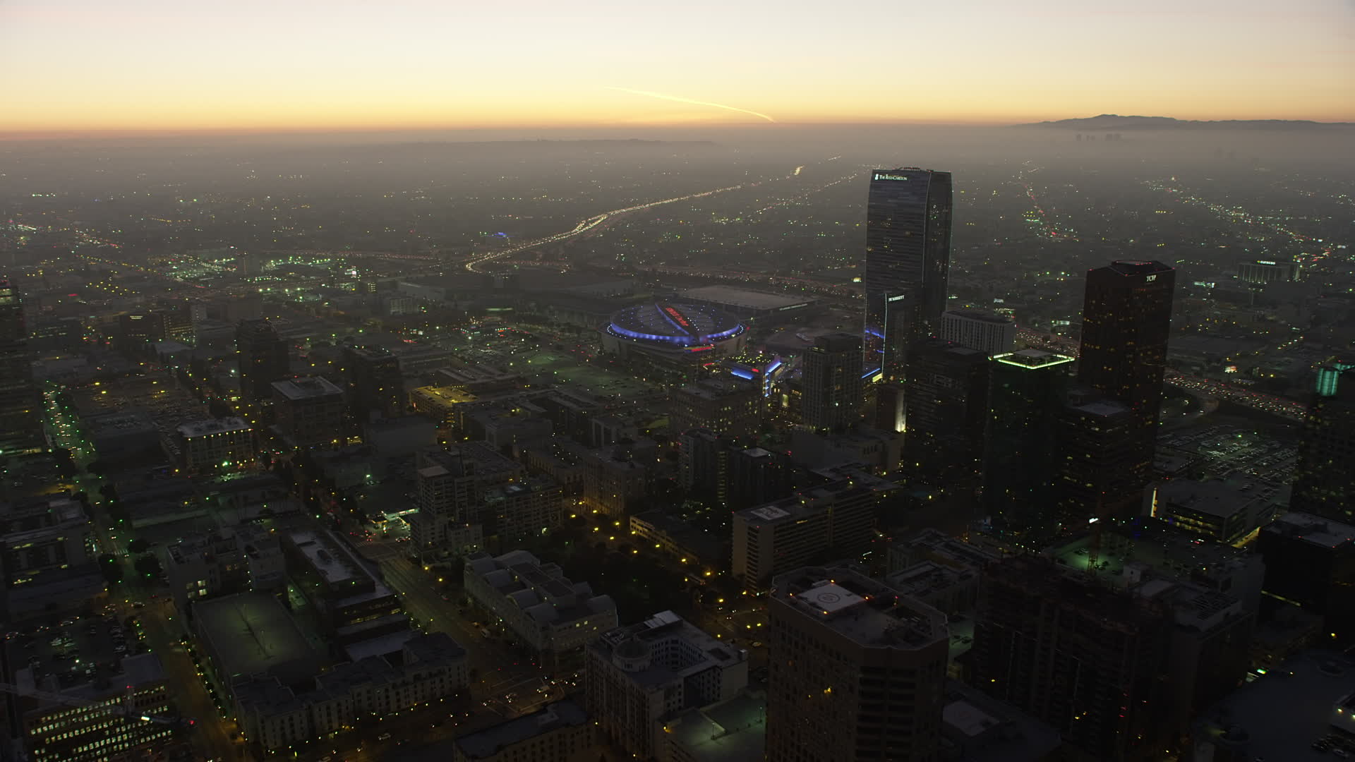 5K stock footage aerial video of Staples Center arena and The RitzCarlton hotel, Downtown Los