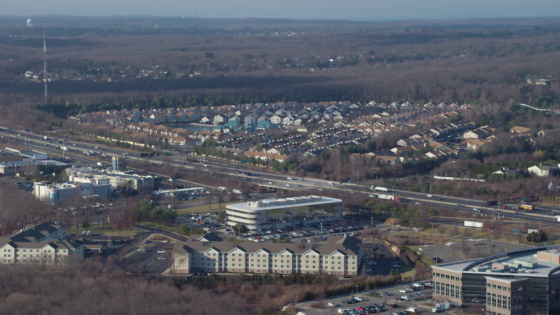 5K stock footage aerial video fly over hotel and office building to