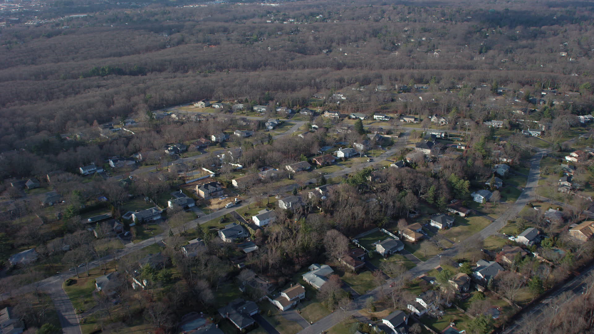 5K stock footage aerial video fly over suburban homes and leafless