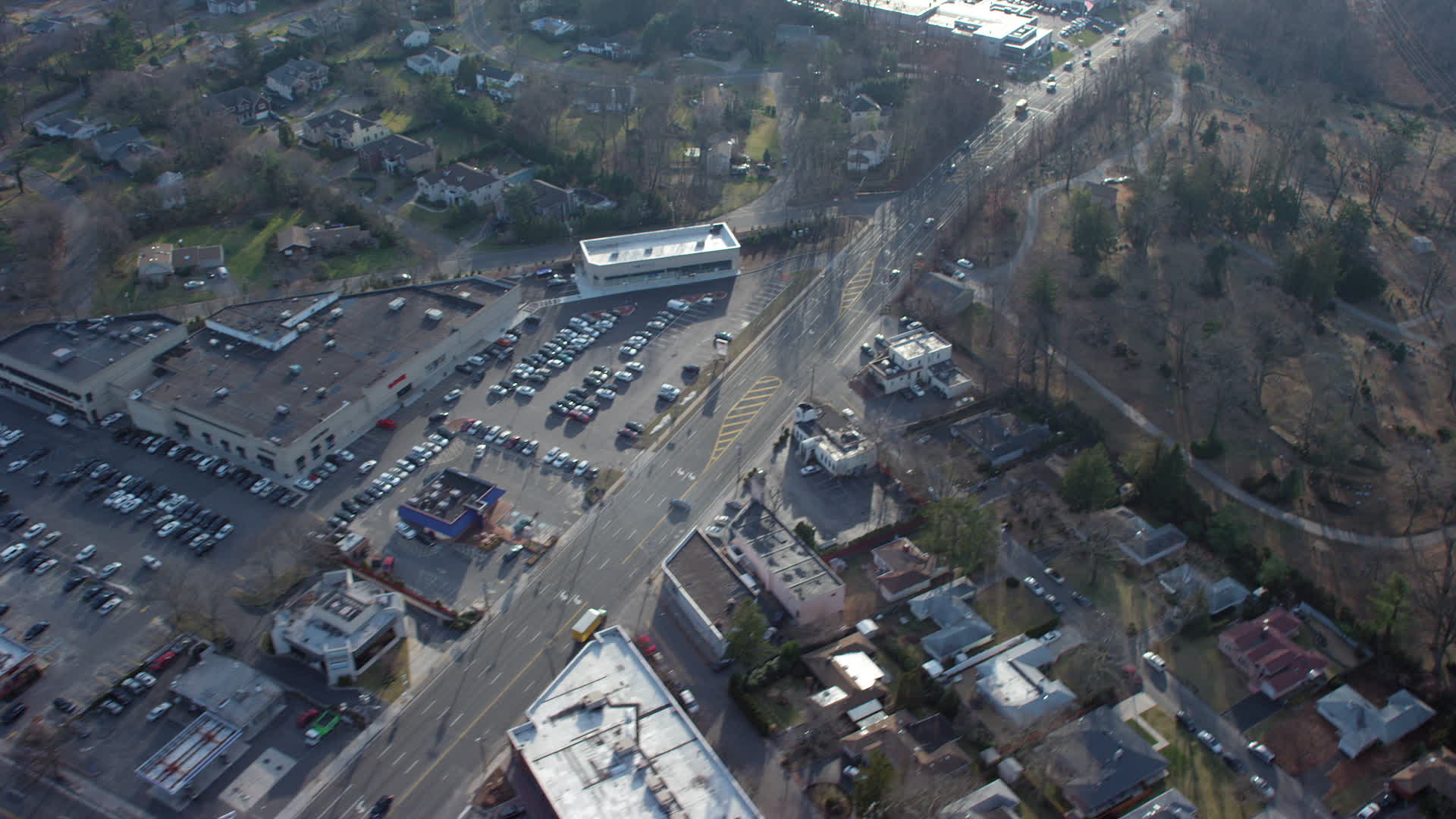 5K stock footage aerial video of passing Northern Boulevard between car