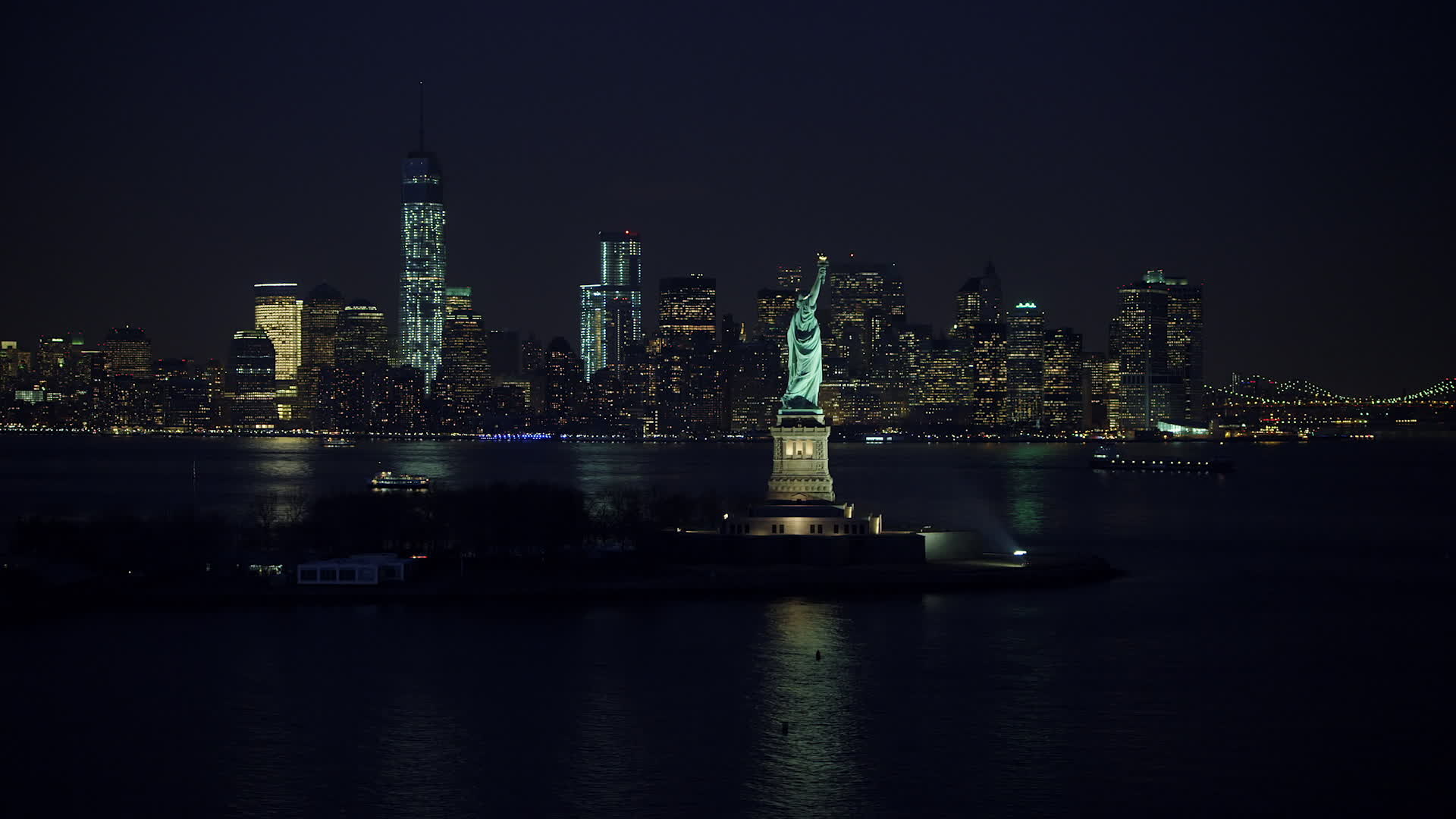 5K stock footage aerial video of Statue of Liberty, and the skyline of
