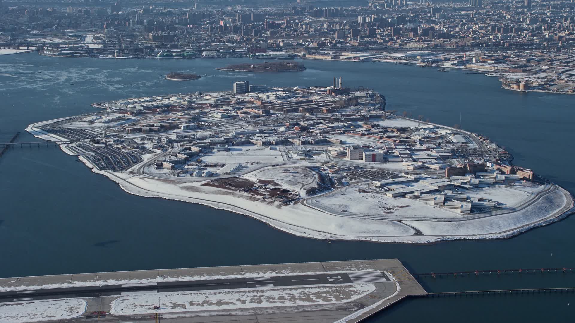 4.8K aerial stock footage video of the prison on Rikers Island in snow