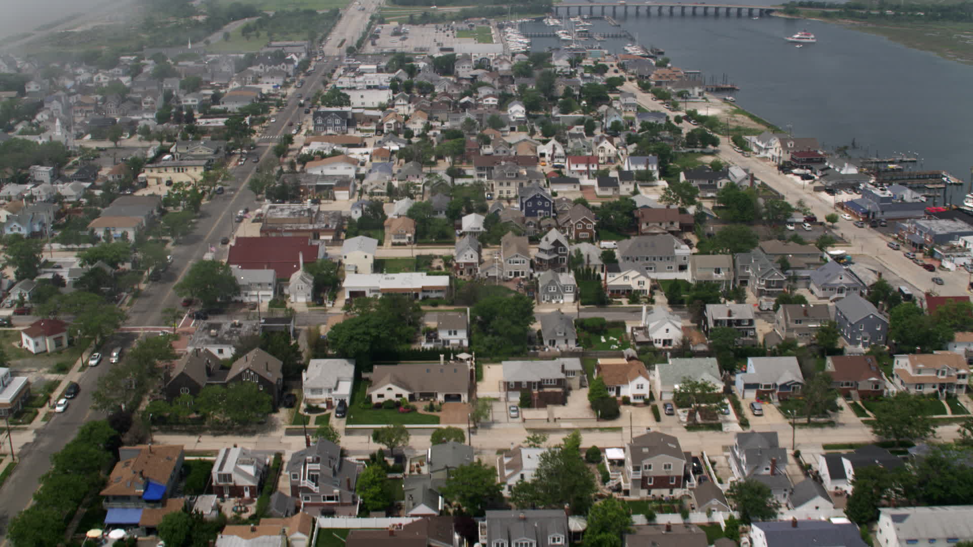 5K stock footage aerial video flying over a seaside neighborhood in