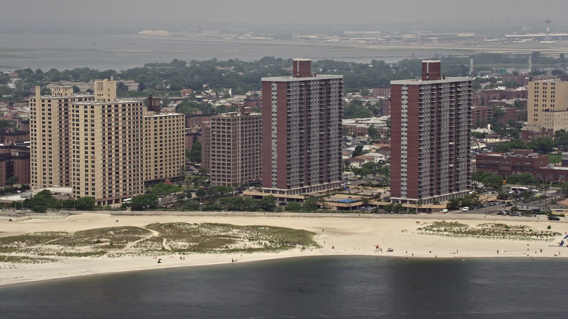 4.8K stock footage aerial video of beachfront apartment buildings in