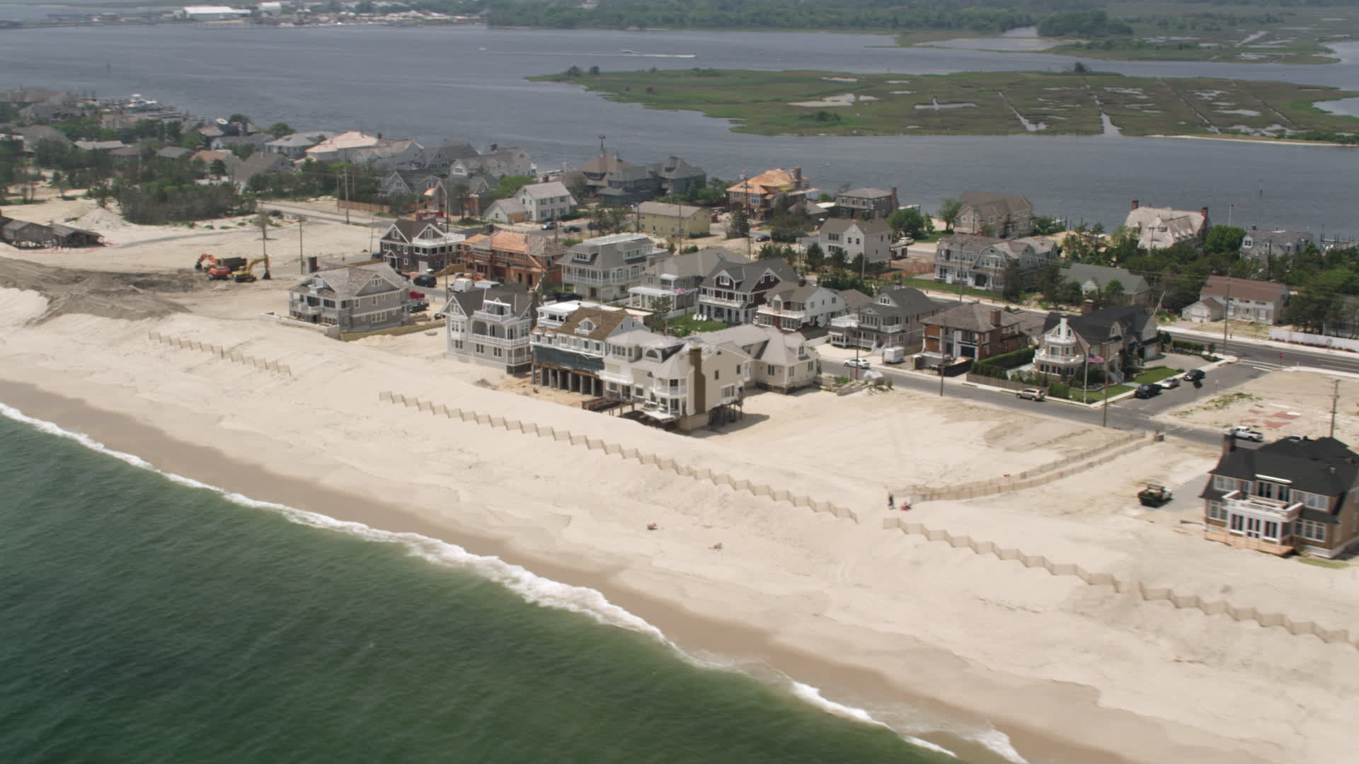 5K stock footage aerial video of beachfront homes in Mantoloking