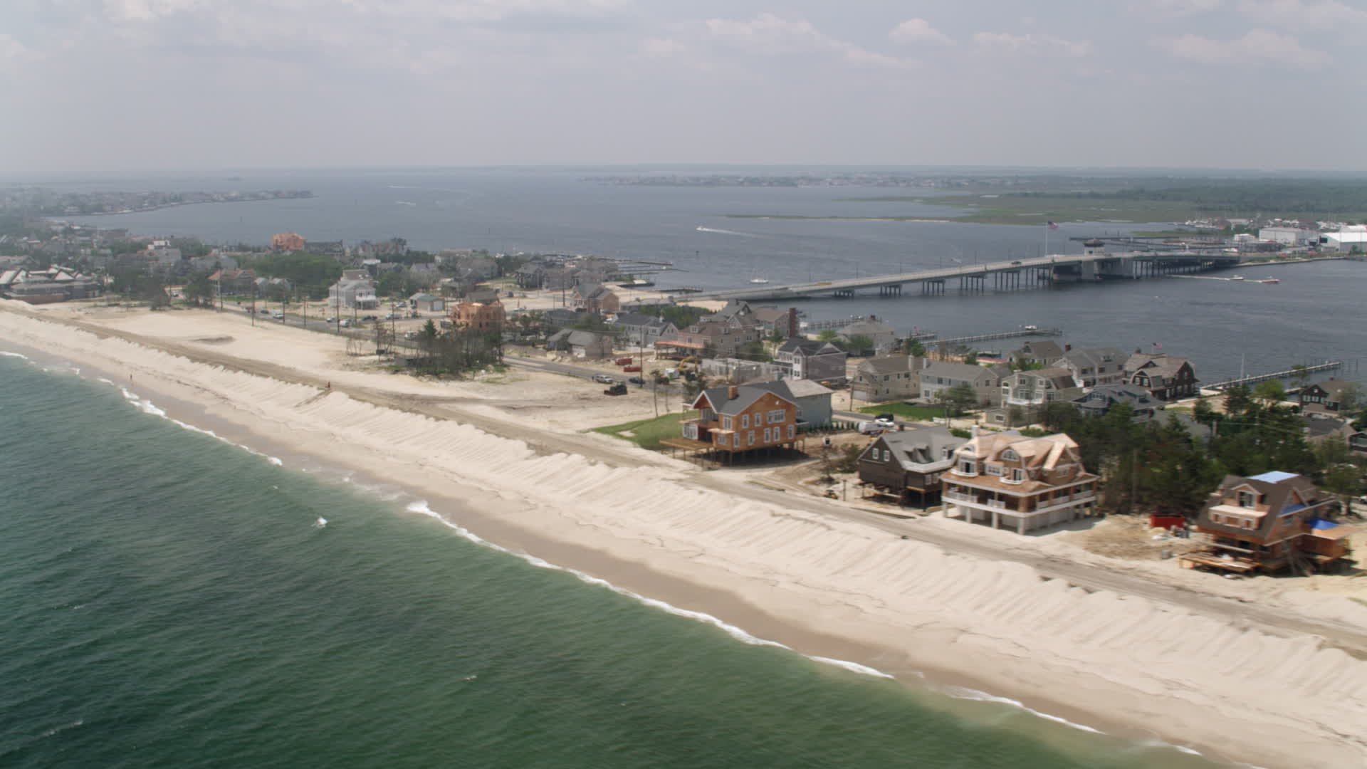 5K stock footage aerial video of beachfront homes in Mantoloking