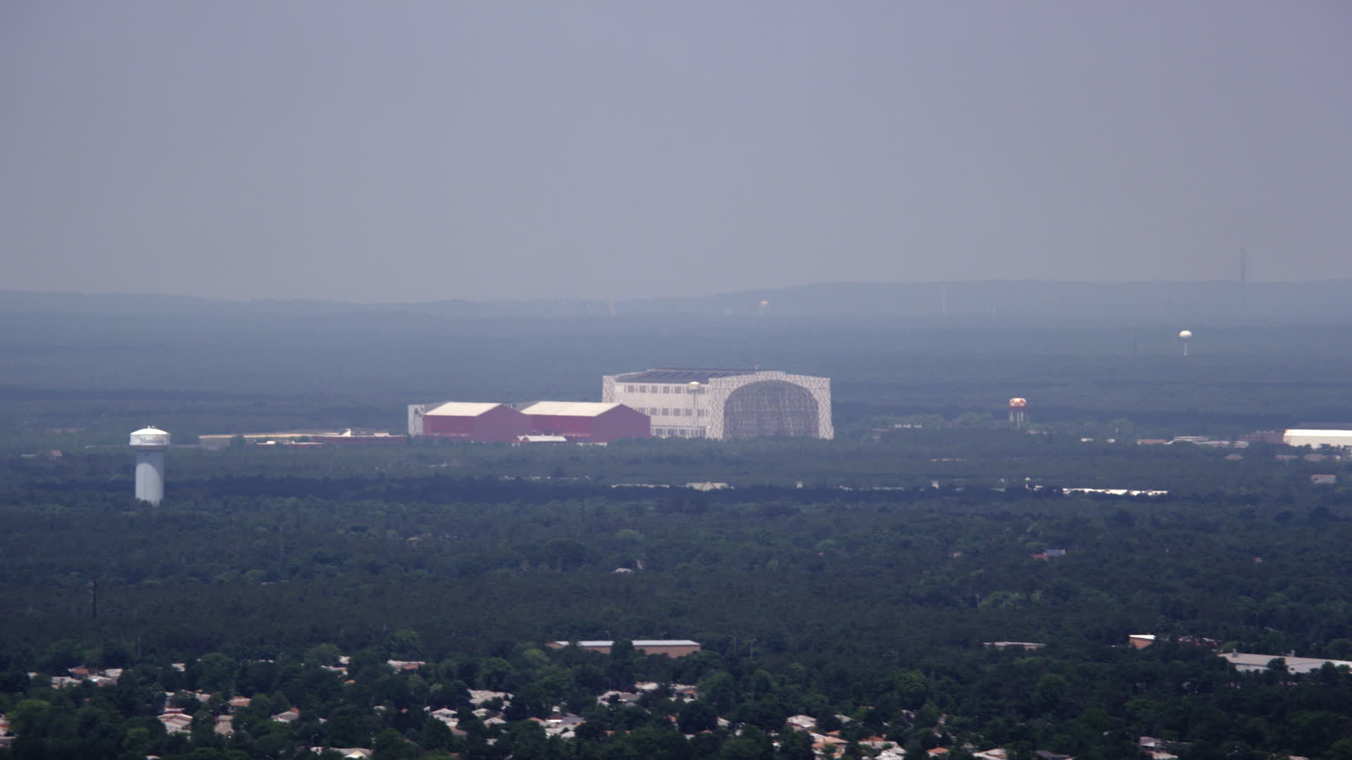 5K stock footage aerial video of Lakehurst Naval Air Station on a foggy