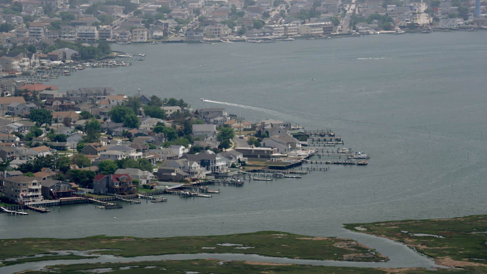 5K stock footage aerial video of bayfront homes with docks in Brigantine, New Jersey Aerial