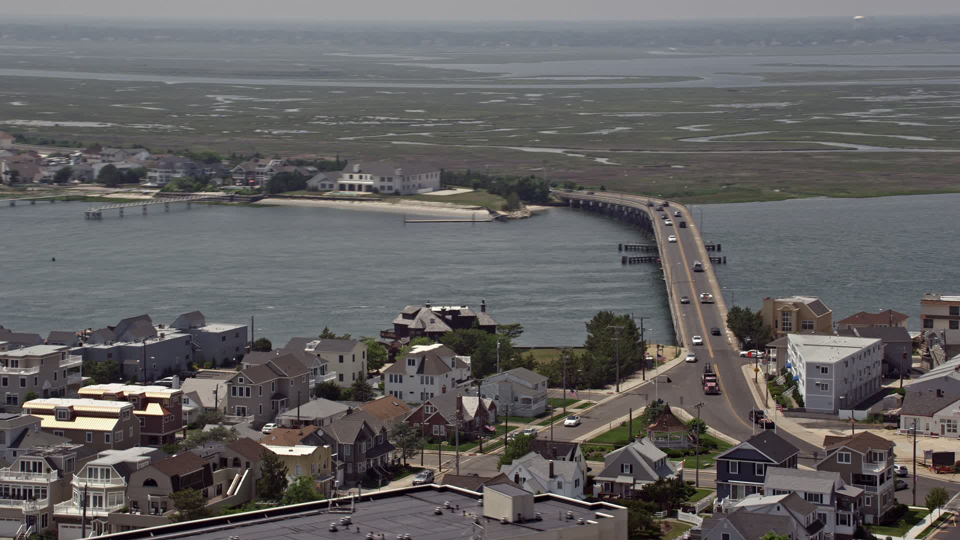 5K stock footage aerial video of JFK Memorial Bridge, waterfront homes