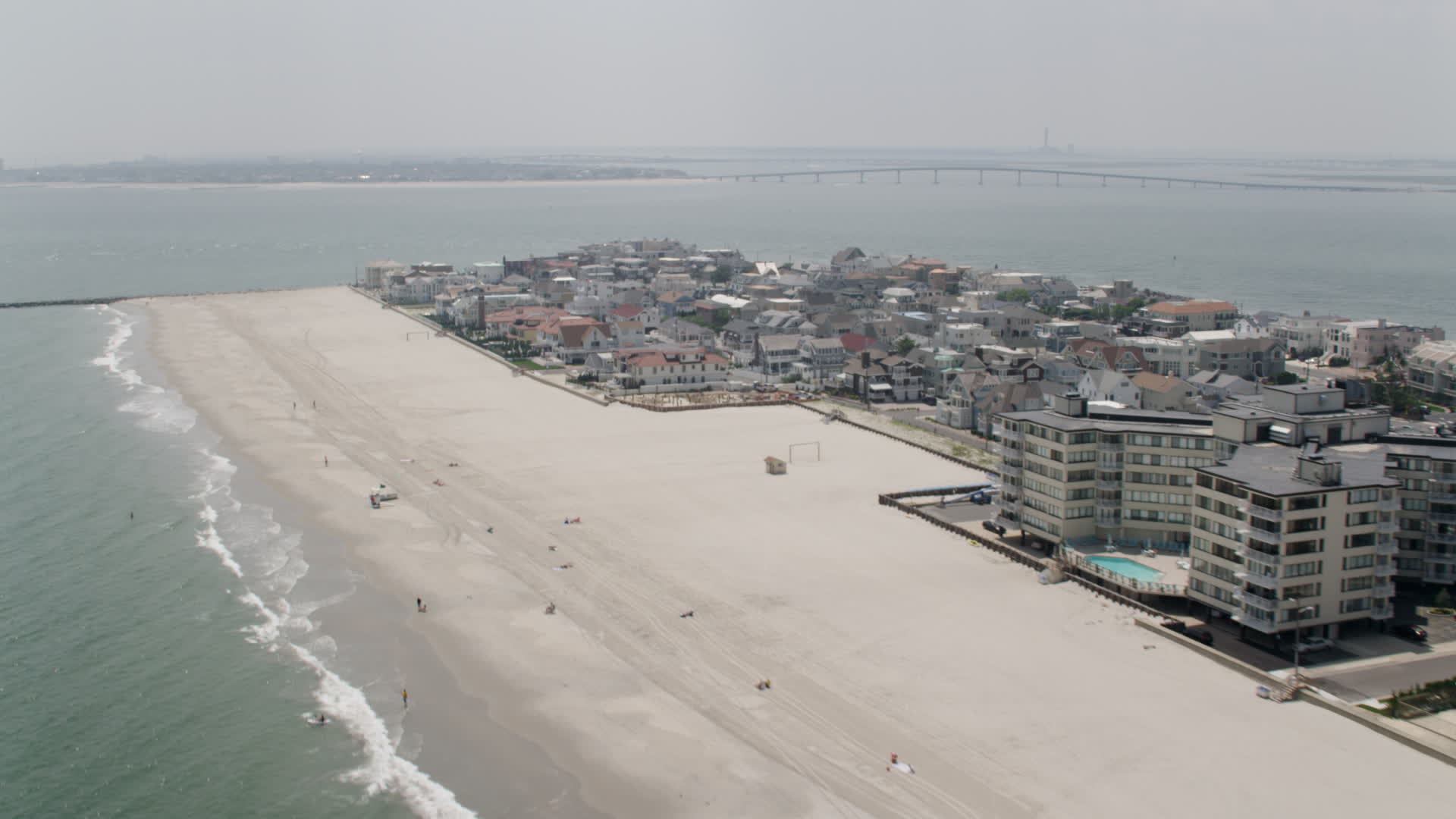 5K stock footage aerial video of upscale beachfront homes in Longport