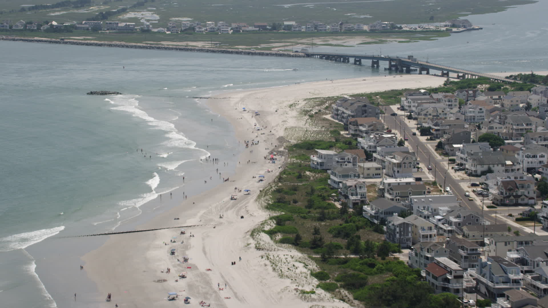 5K stock footage aerial video of beach goers near Townsends Inlet