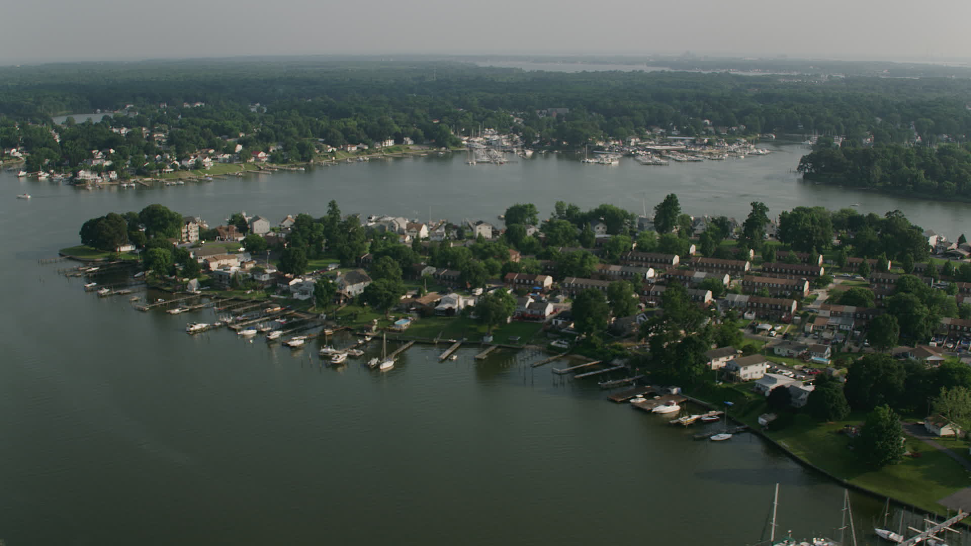 5K stock footage aerial video of row houses and riverfront homes with