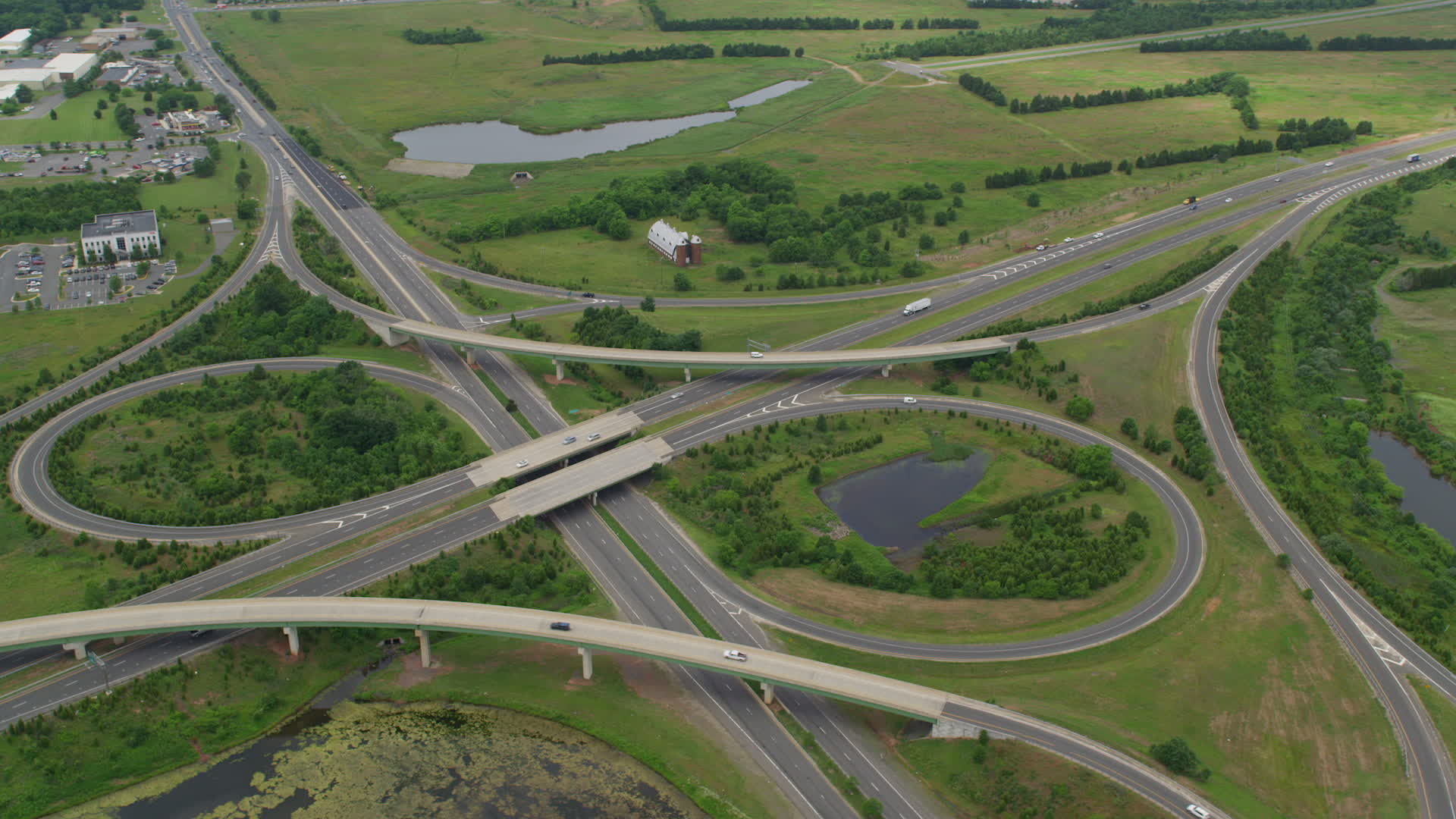 5K stock footage aerial video of light traffic on interchange between Prince William Parkway and