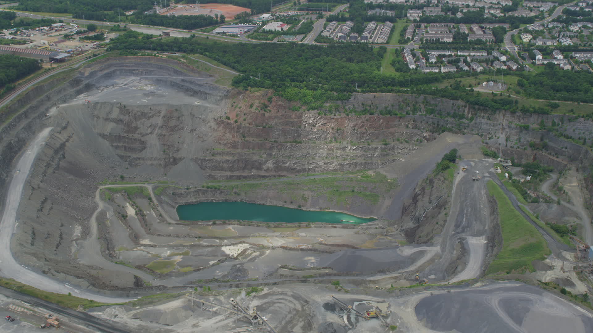 5K stock footage aerial video of Vulcan Lake in a deep quarry in