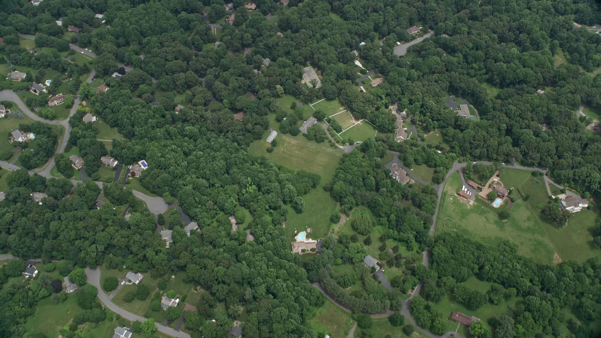 5K stock footage aerial video of a bird's eye view of upscale homes