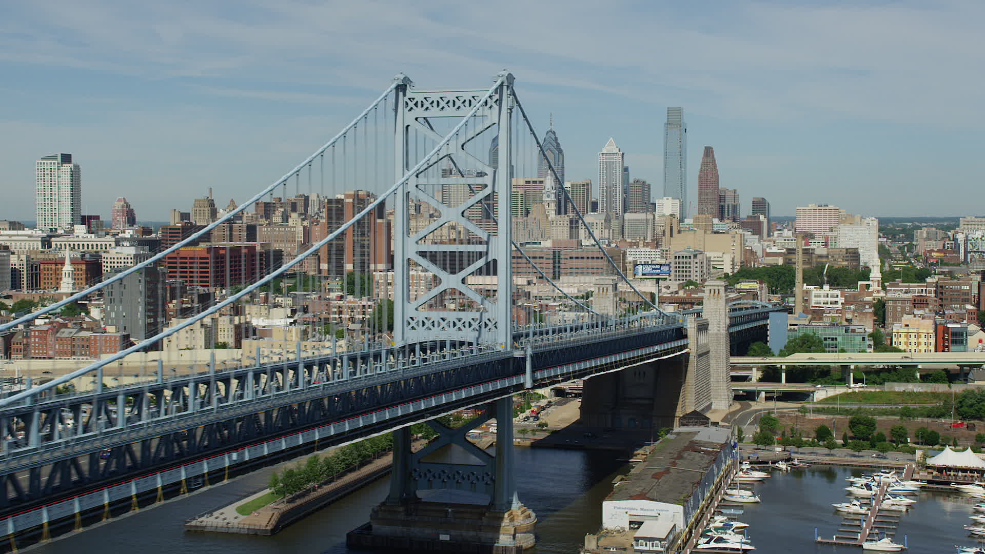 5K stock footage aerial video flying by the Benjamin Franklin Bridge to
