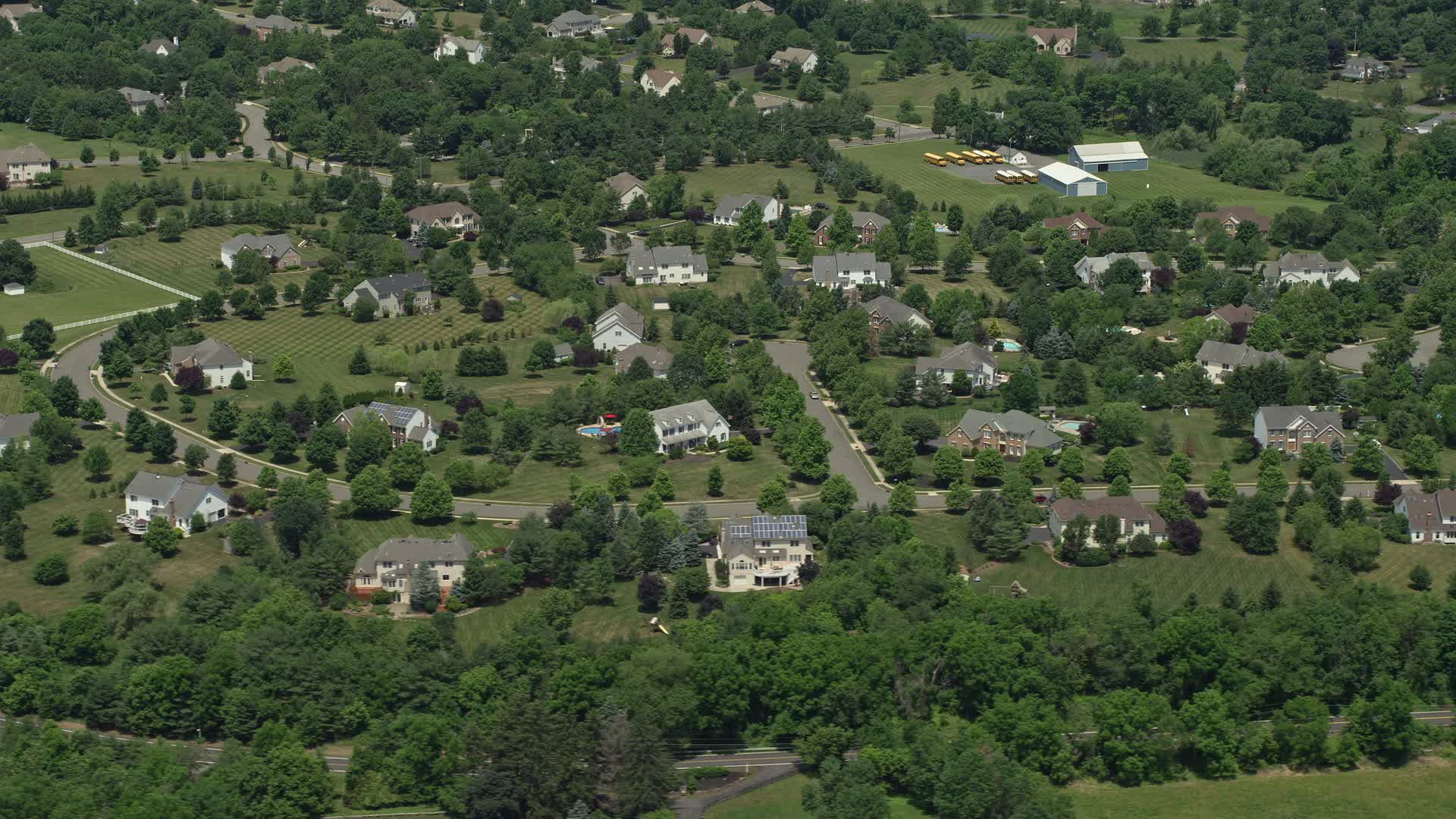 4.8K stock footage aerial video of upscale homes and treelined streets