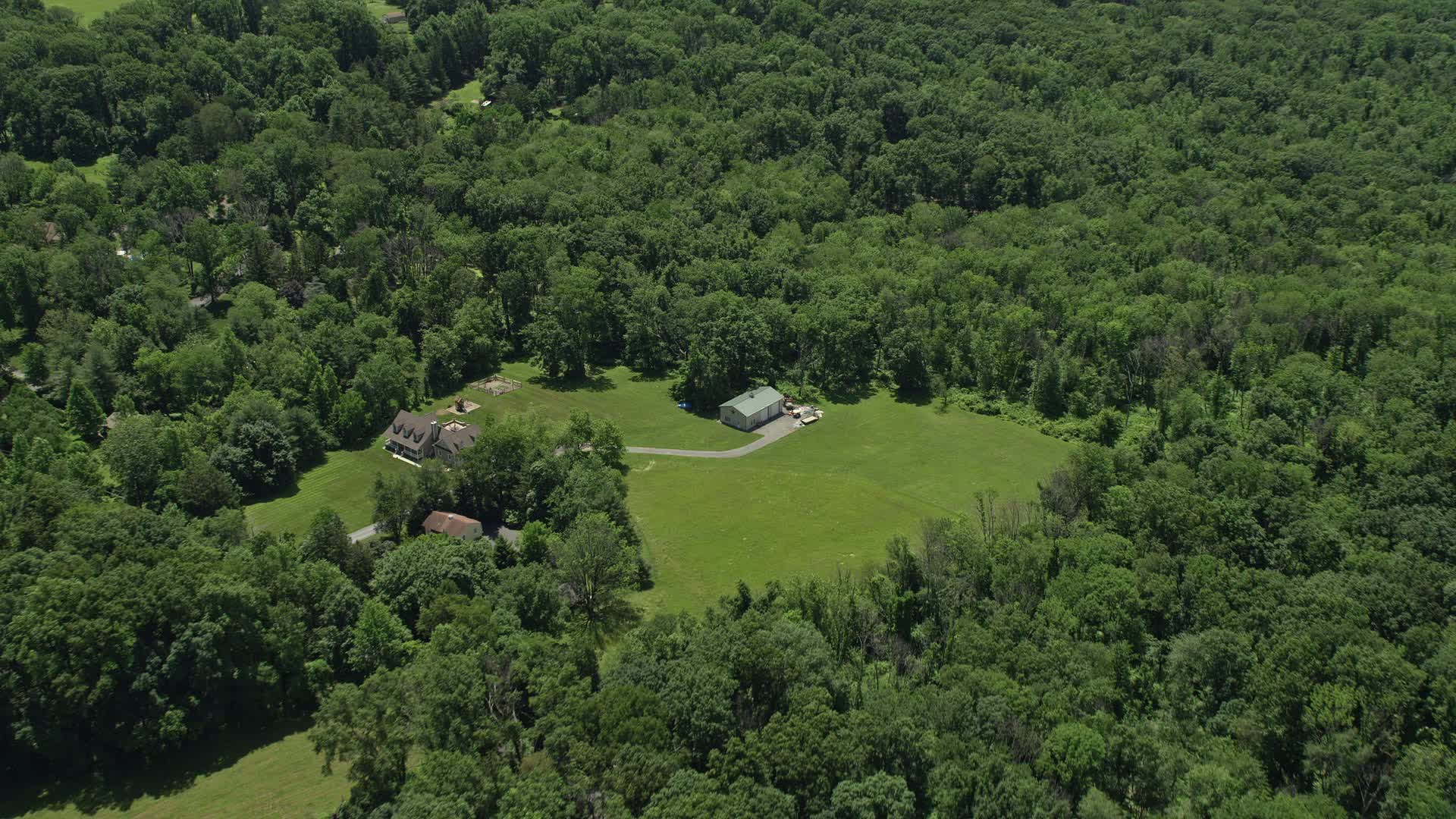 4.8K stock footage aerial video of a rural home with a barn in Belle