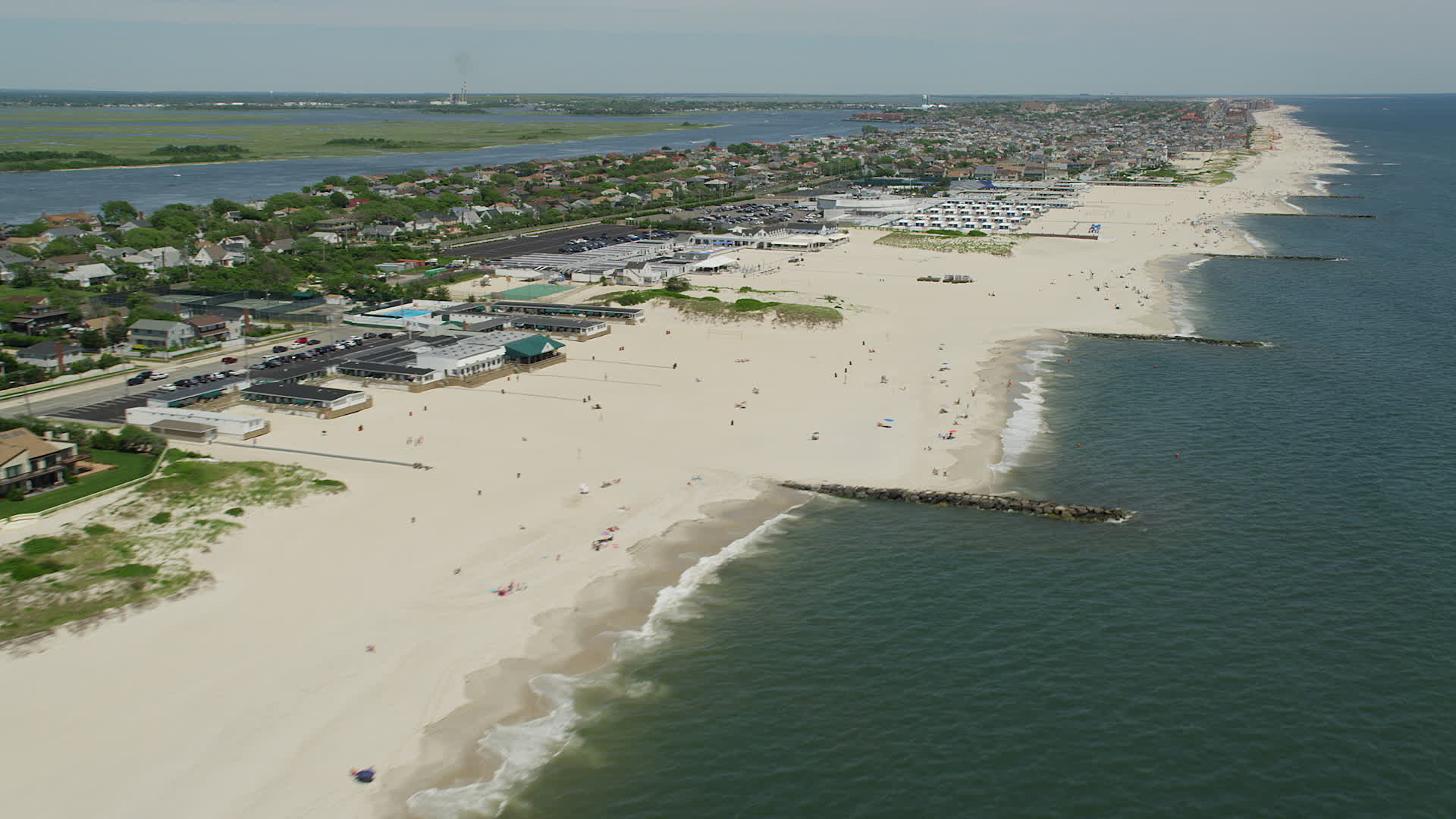 5K stock footage aerial video of beachgoers and beachfront