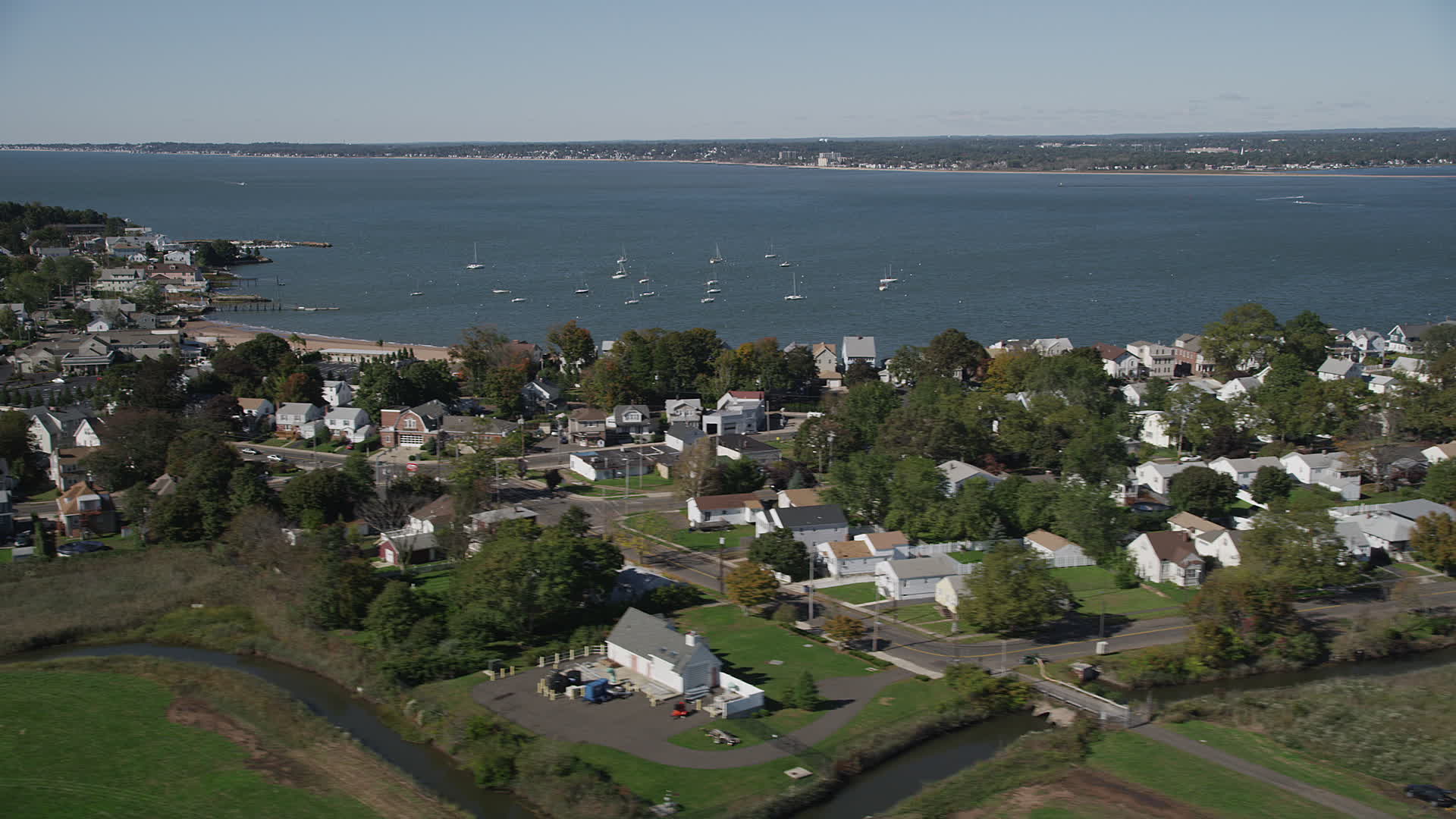 4K stock footage aerial video of flying by homes and Morris Cove, New