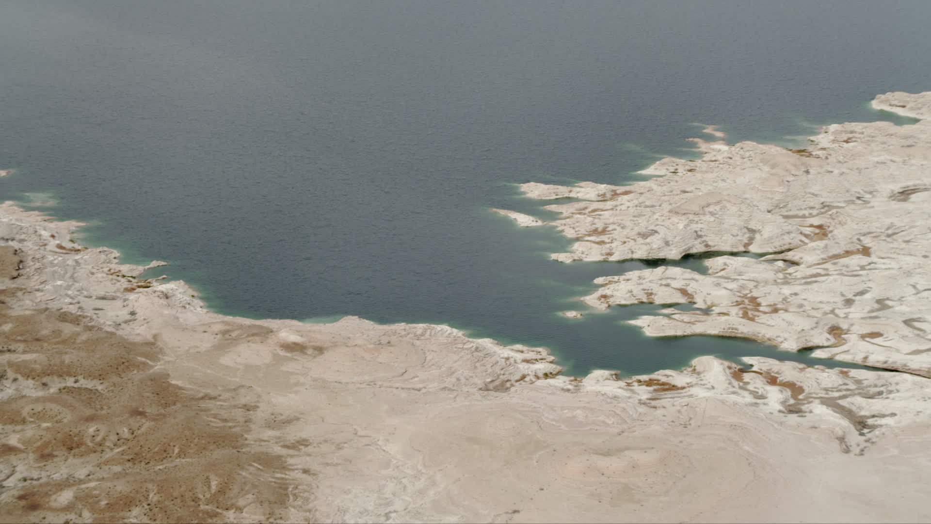 4K stock footage aerial video of flying by Gypsum Bay on Lake Mead, Las