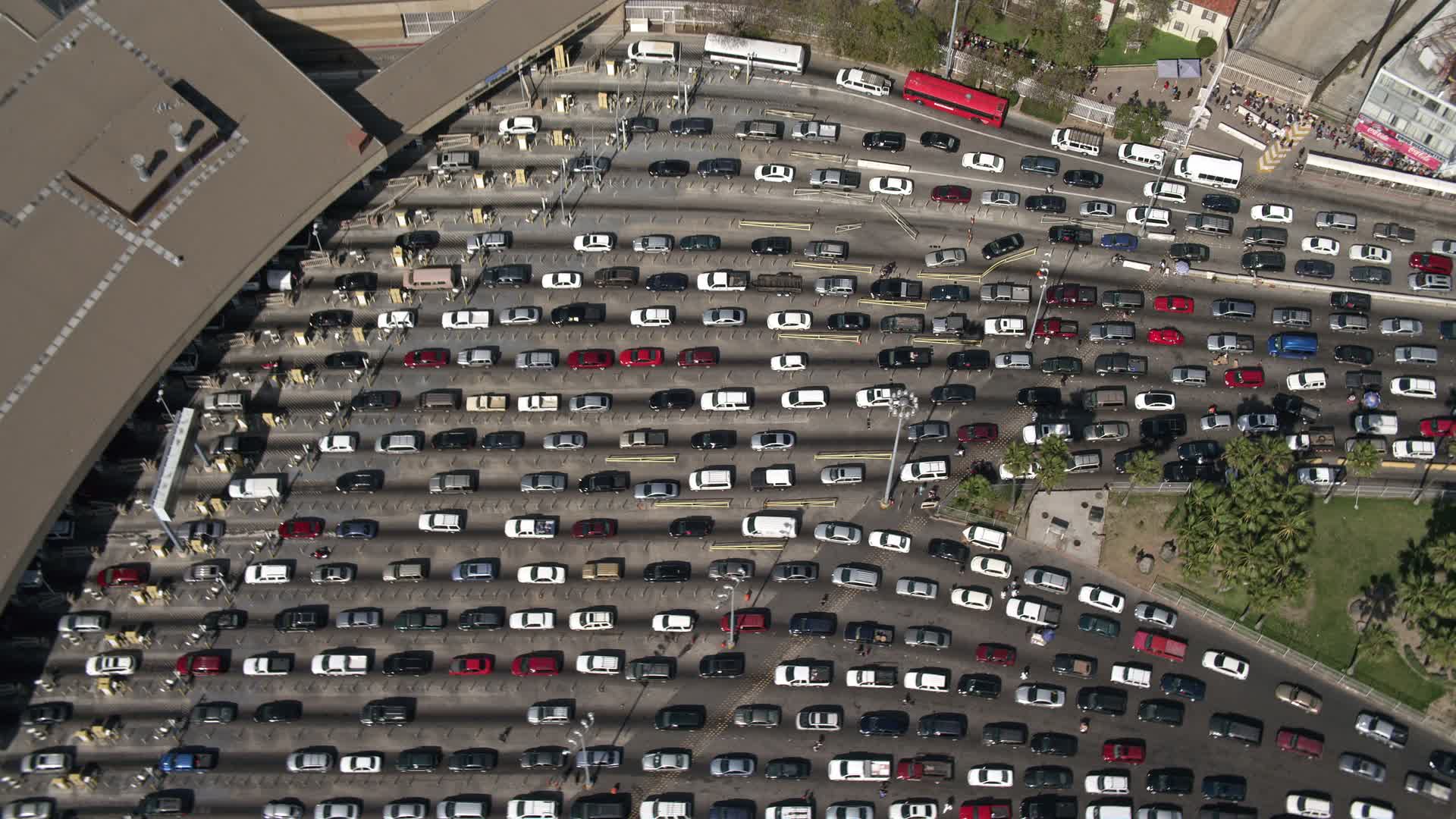 4K stock footage aerial video of a bird's eye view of heavy checkpoint traffic, US/Mexico Border