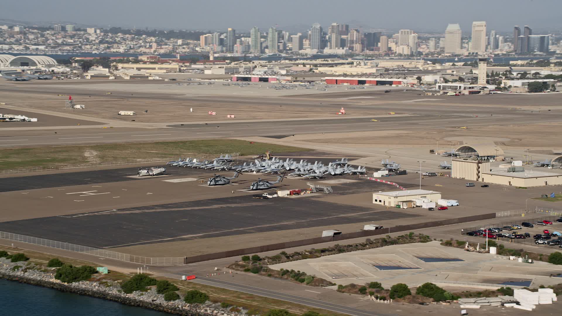 4K stock footage aerial video of military jets and helicopters on an
