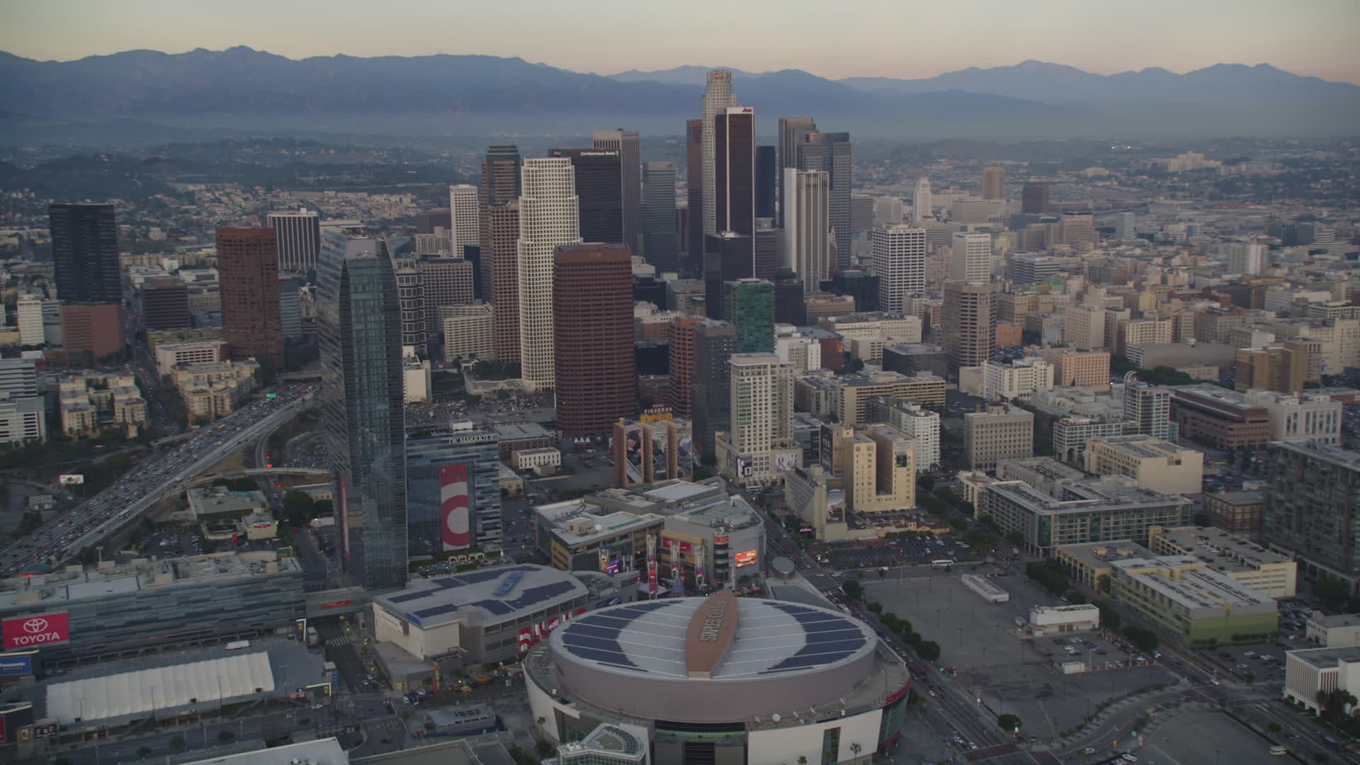 5K stock footage aerial video of Staples Center, The RitzCarlton and skyscrapers in Downtown
