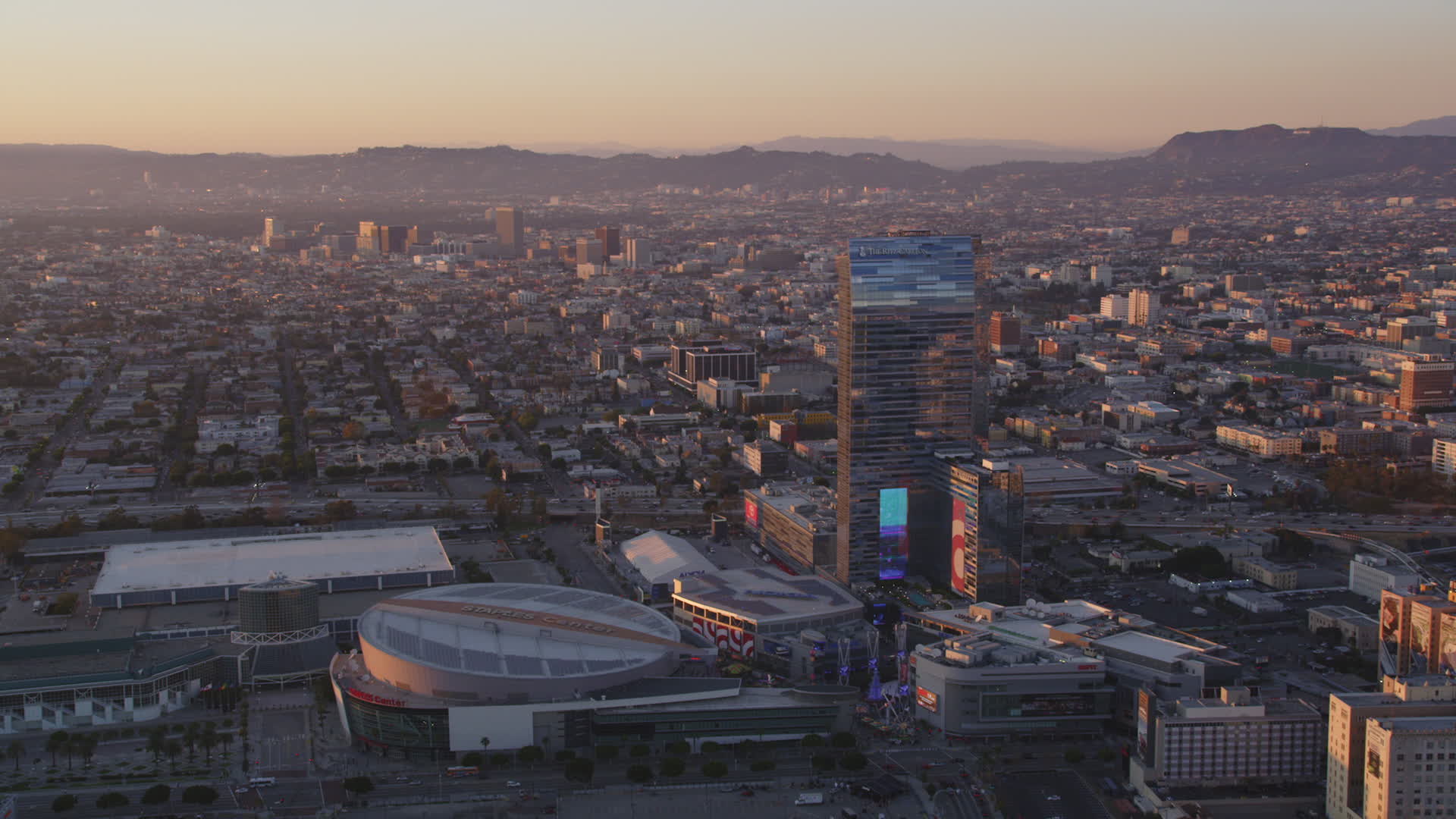 5K stock footage aerial video of Staples Center and RitzCarlton Hotel in Downtown Los Angeles