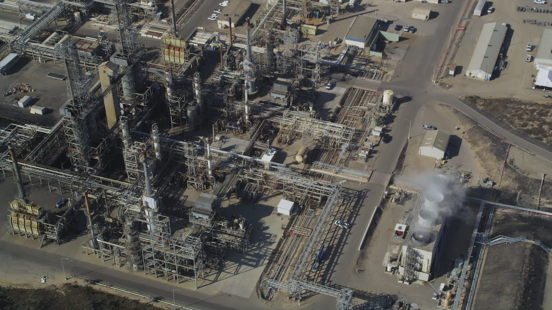 5K stock footage aerial video Fly away from Phillips 66 Company Santa