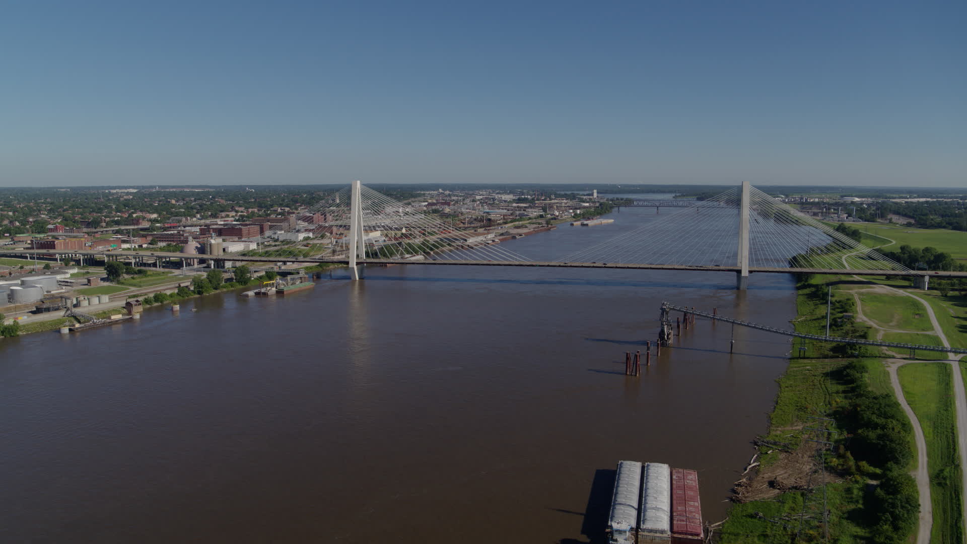 6K drone aerial of a cablestayed bridge spanning a river, St. Louis