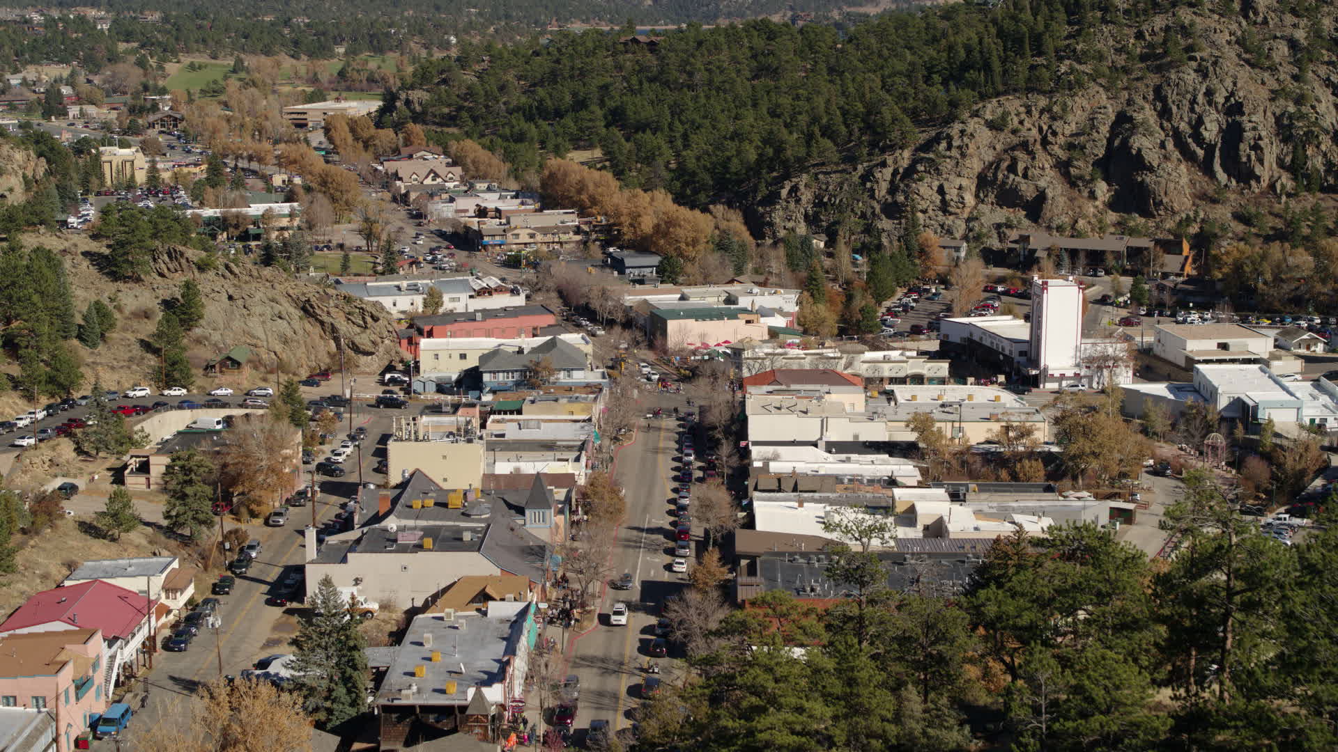 5.7K stock footage aerial video a reverse view of shops on road through