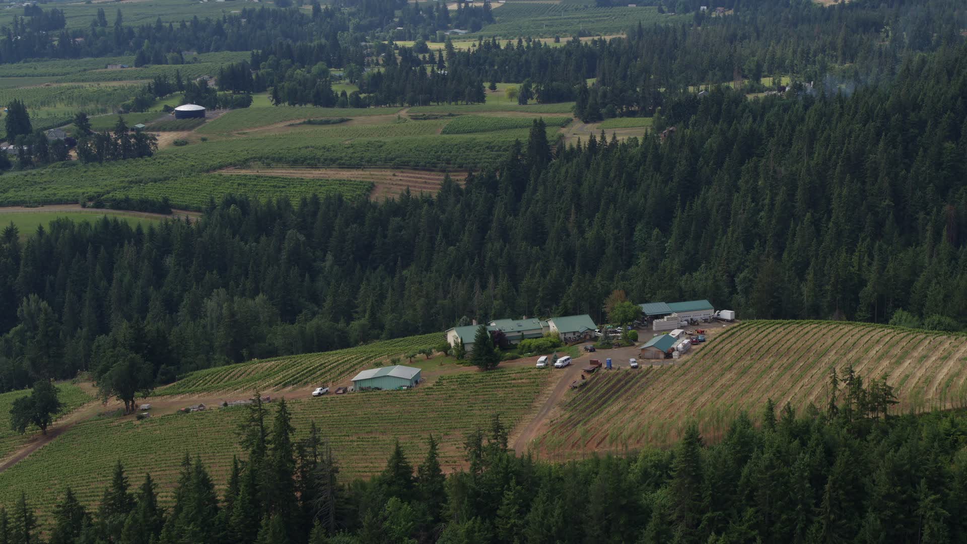 5.7K stock footage aerial video of approaching and flying by the hilltop Phelps Creek Vineyards
