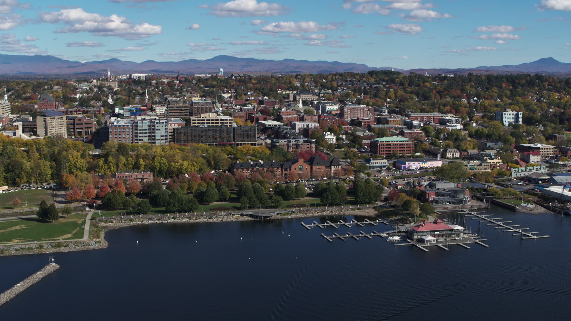 5.7K stock footage aerial video of orbiting city buildings, park and