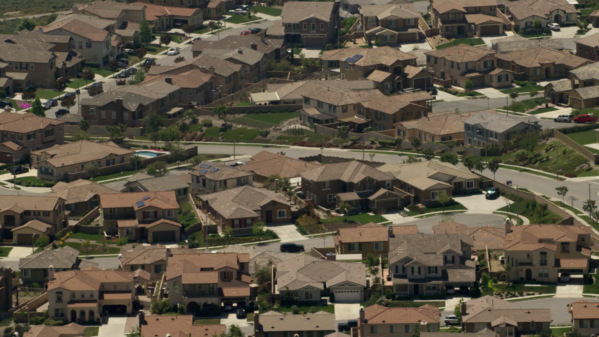 4K stock footage aerial video of large homes in a suburban residential