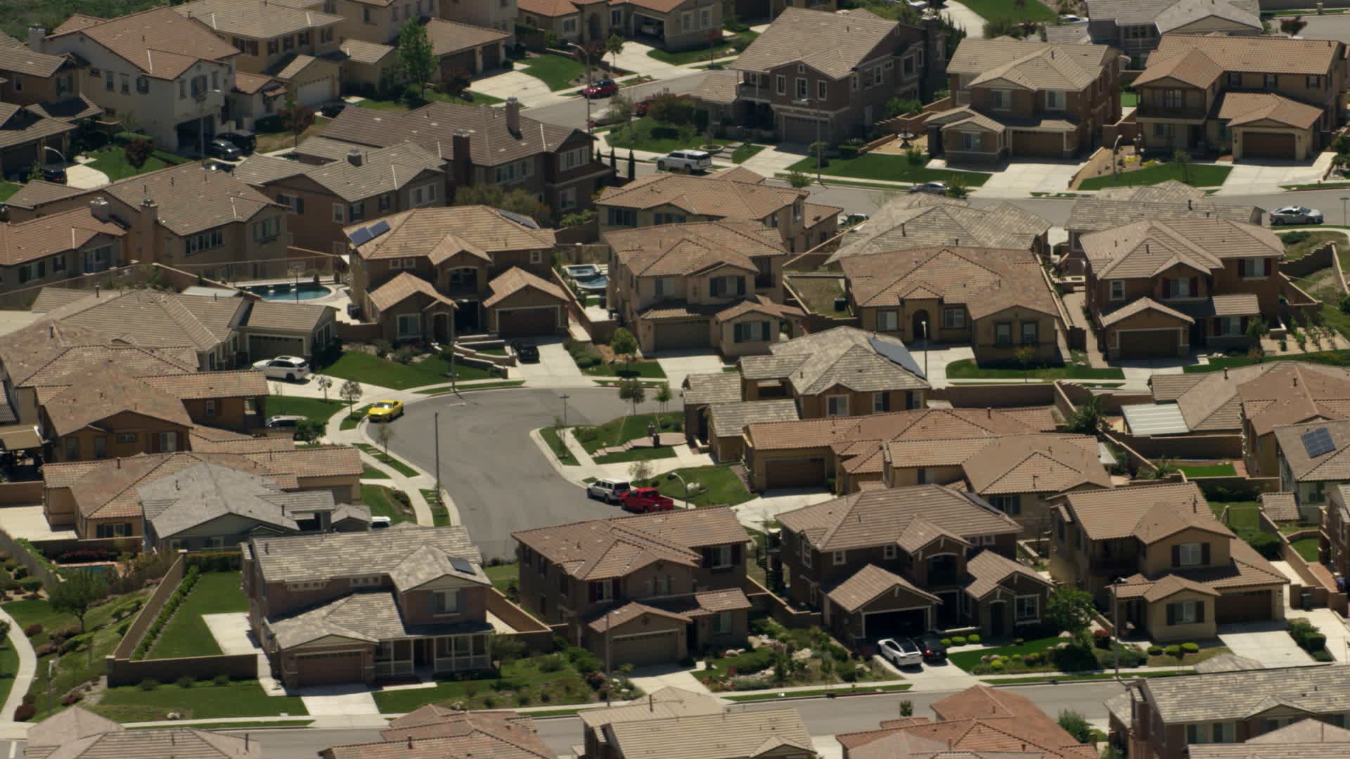 4K stock footage aerial video of spacious homes in a suburban