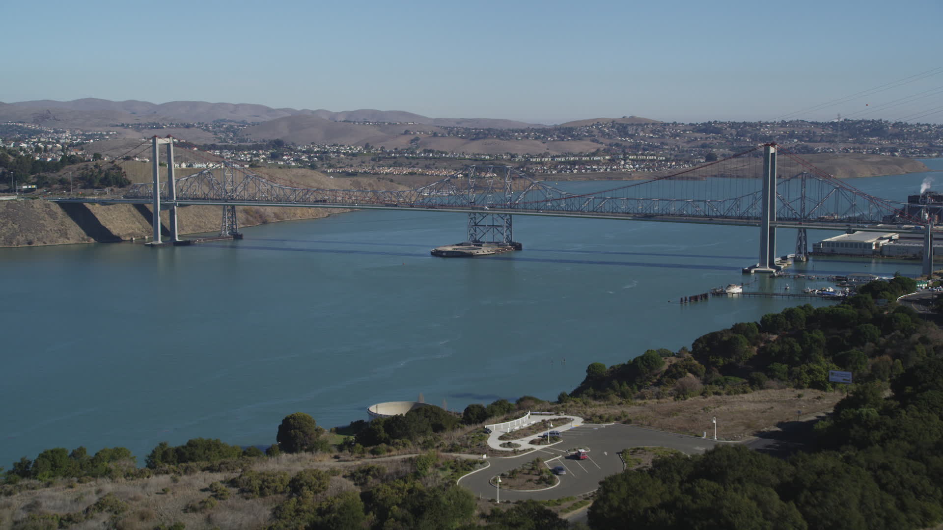 5K stock footage aerial video of flying over hill, revealing Carquinez