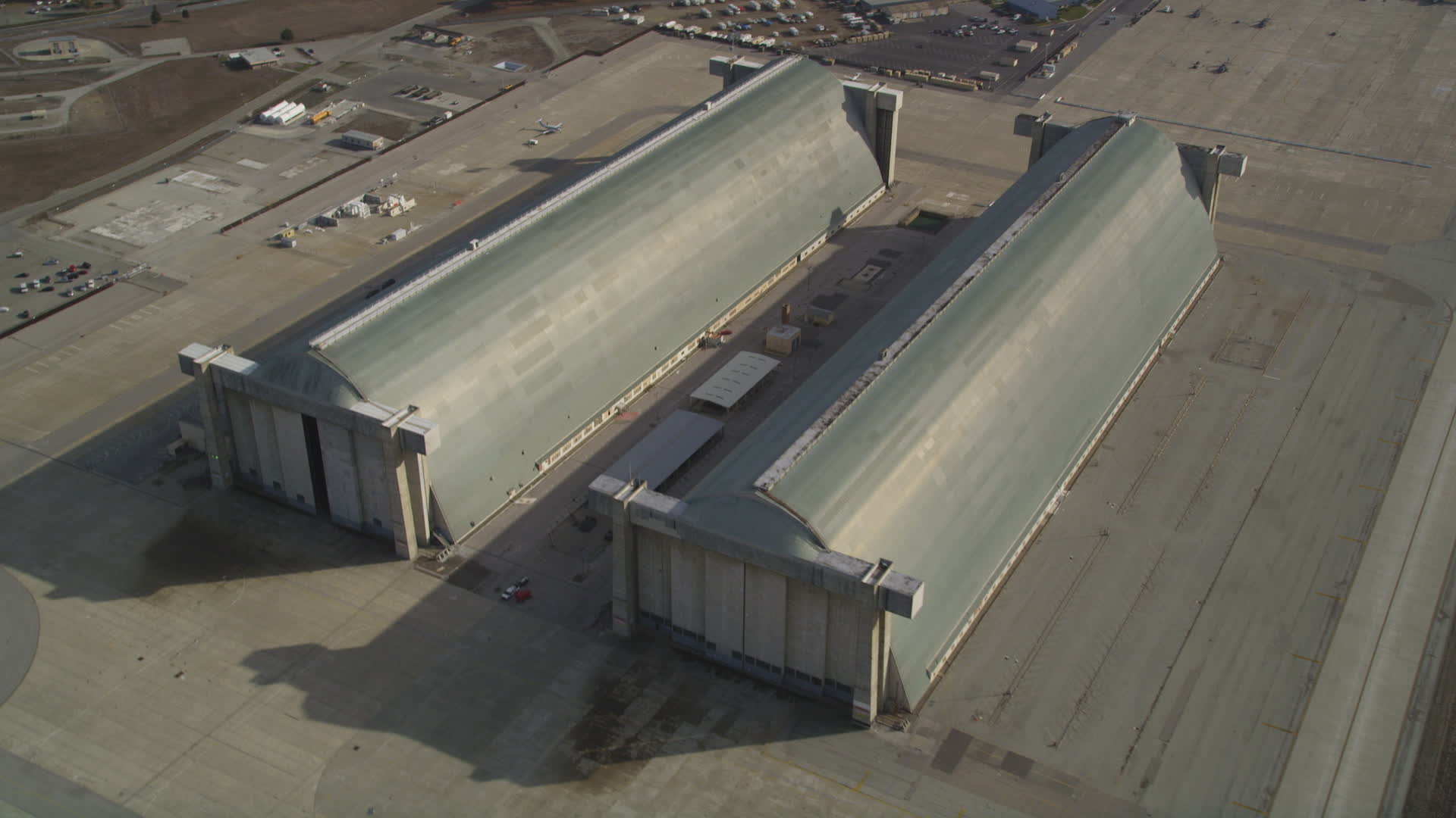 5K stock footage aerial video tilt to reveal Hangar Two, Hangar Three