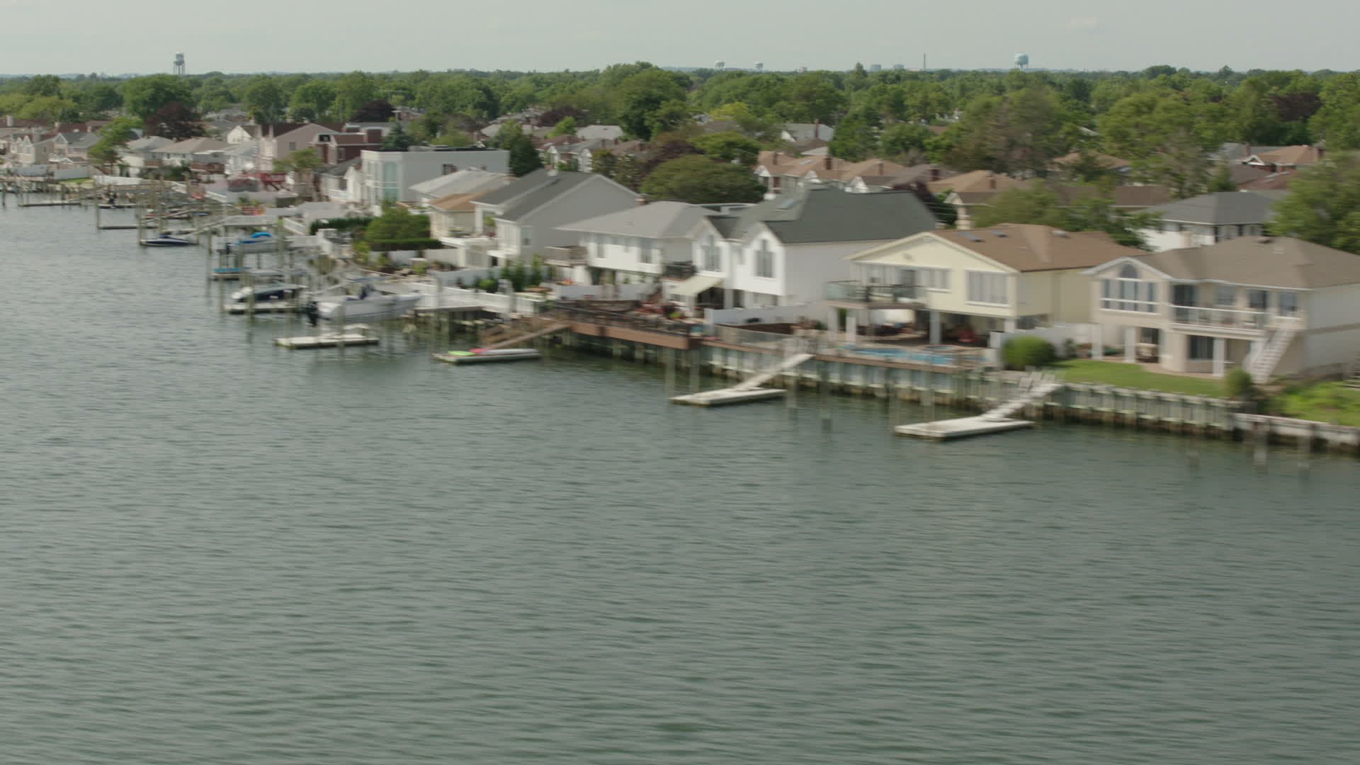 HD stock footage aerial video flyby waterfront homes with docks by the