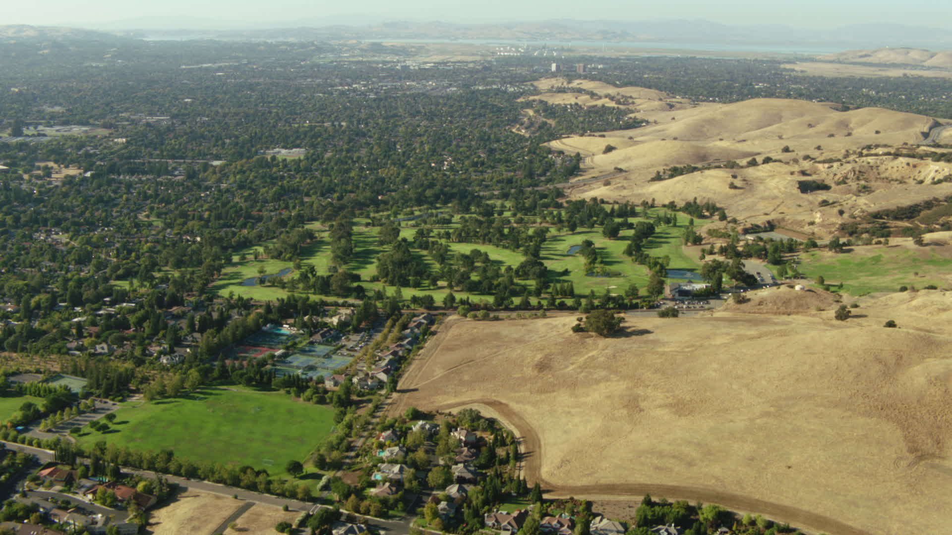 1080 stock footage aerial video of neighborhoods and golf course in