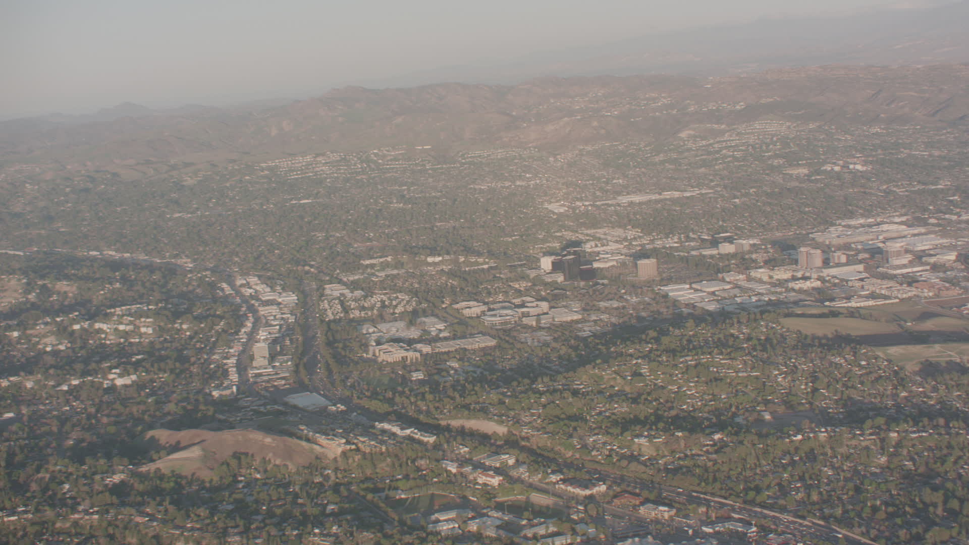 4K stock footage aerial video pan across hillside homes and suburban